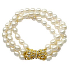 Süßwasserperlen- und Diamantarmband in 18K Goldfassung