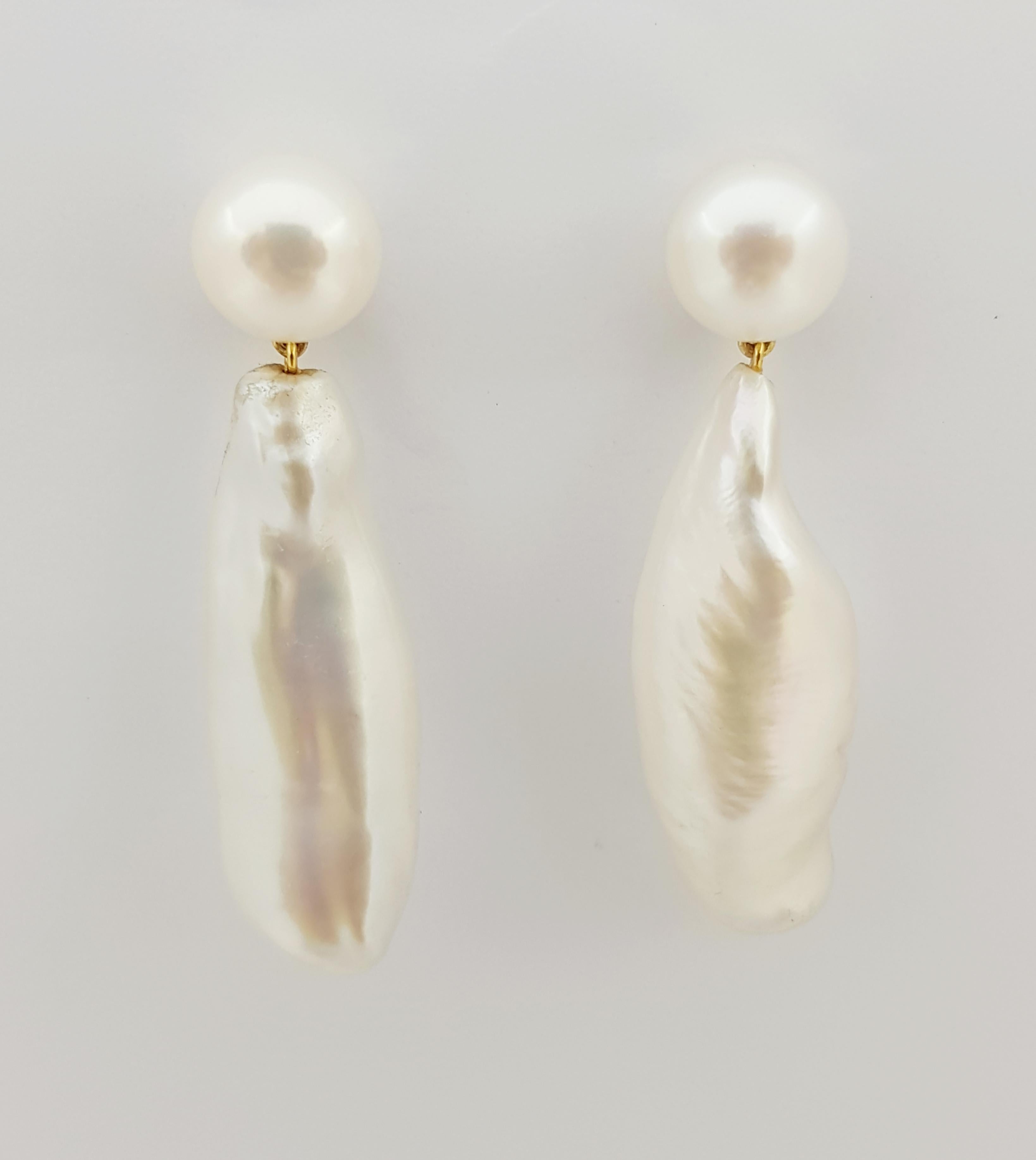 pearl earrings in gold setting