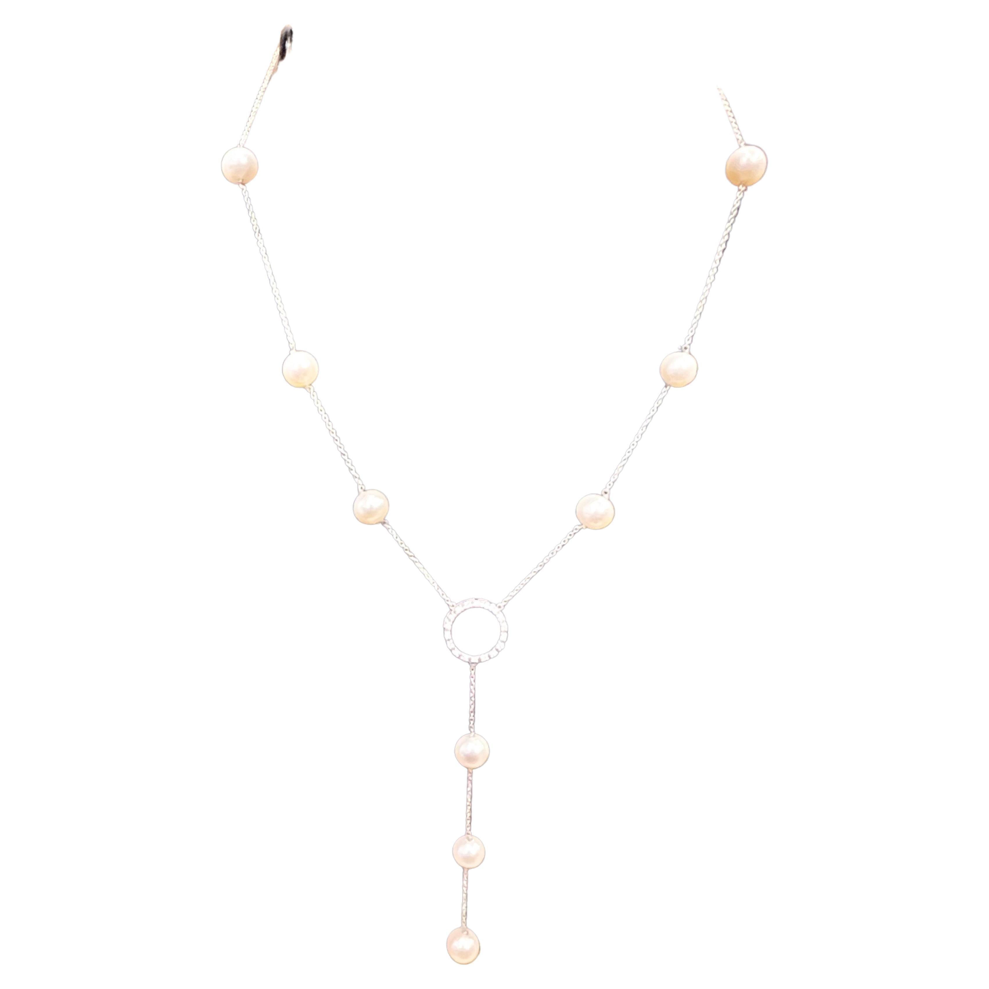 Fresh Water pearl  in Sterling Silver And Cubic Zirconia Necklace, 22 Inch
Cubic Zirconia or CZ is the cubic Crystalline form Of Zirconium dioxide. Its Hard and Usually  colorless.
It has a circle of CZ in the center and has  9 fresh water