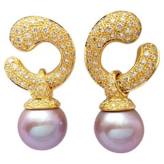 Orecchini con perle d'acqua dolce e diamanti marroni incastonati in oro 18K