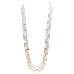 Collier en or blanc 18 carats serti de perles d'eau douce et de diamants