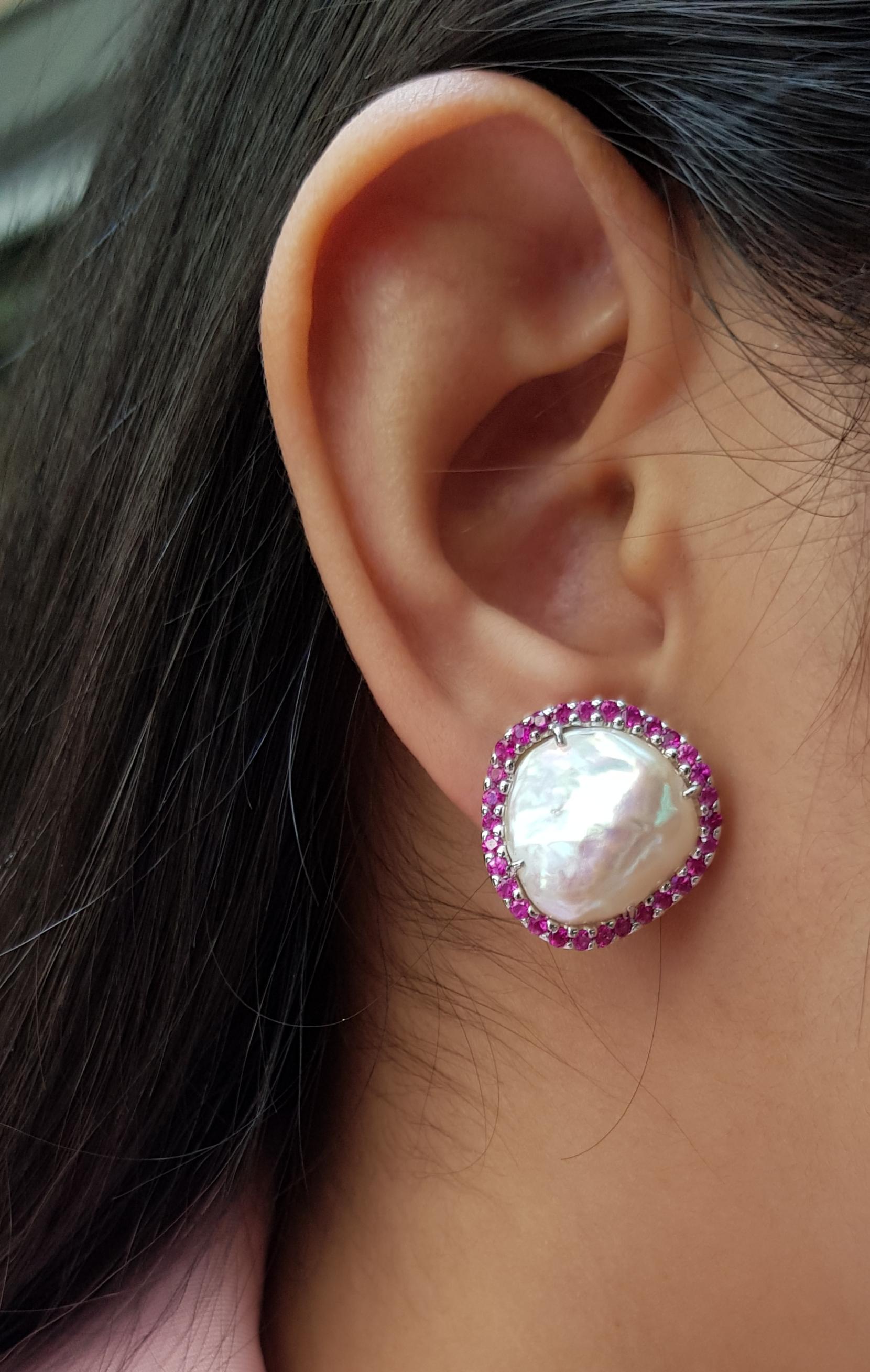 Fresh Water Pearl with Ruby 1.58 carats Earrings set in 18 Karat White Gold Settings

Width: 2.0 cm
Length: 2.0 cm 

