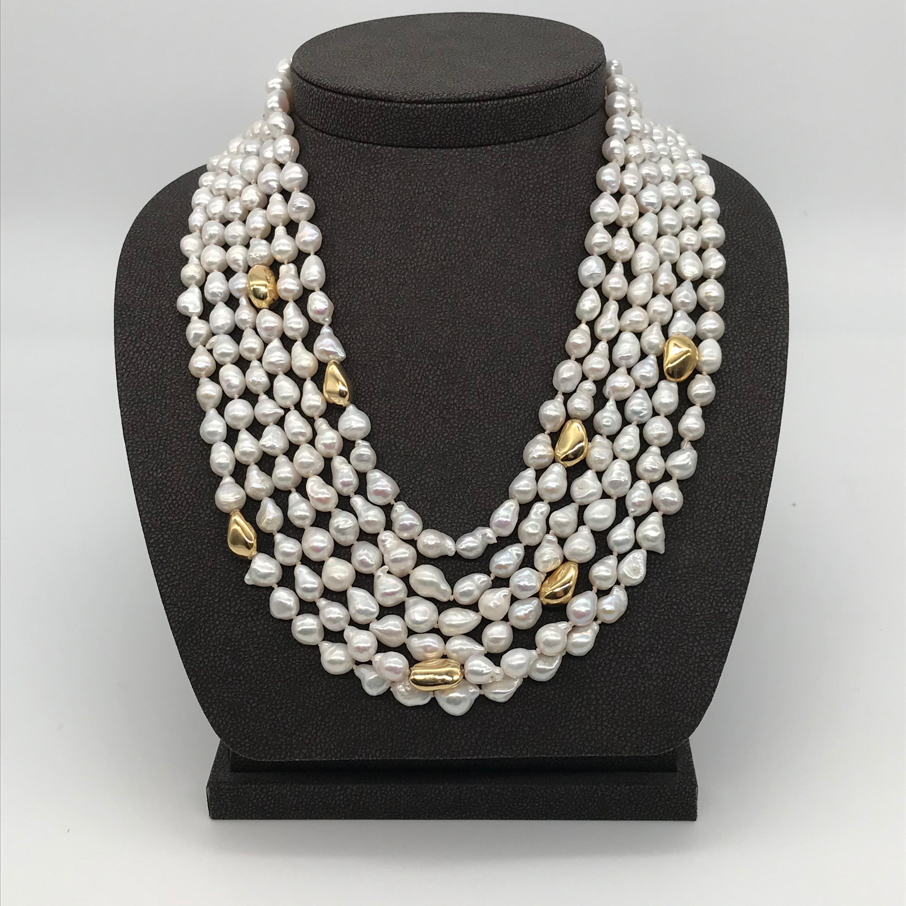 Welcome to the refined, elegant world of our one-of-a-kind necklace: the natural freshwater baroque pearl necklace with bakelite safety clasp on yellow gold. This exceptional piece embodies the perfect fusion between the organic beauty of baroque