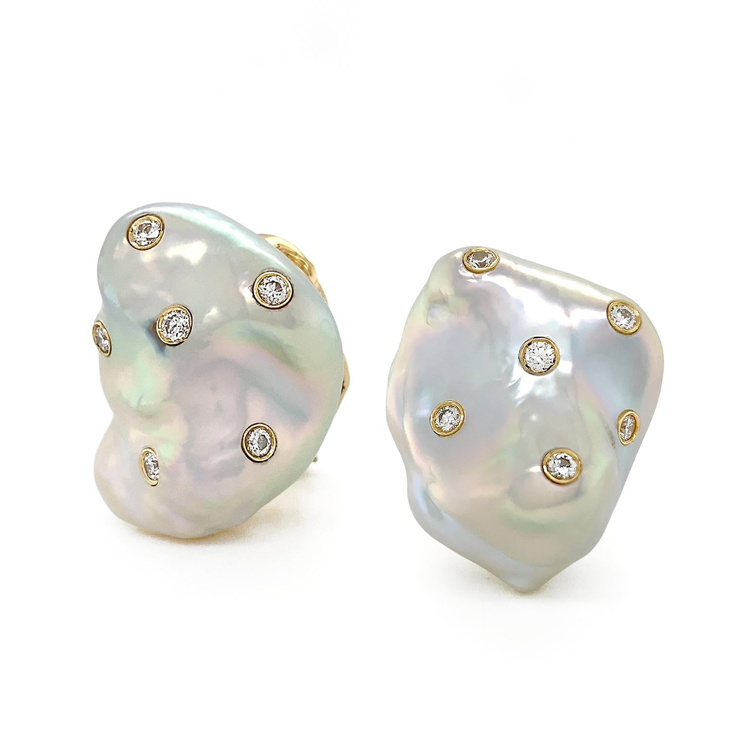 Glimmering iridescent baroque pearls feature flickering diamonds for these earrings. A silken glow showcases the organic contours of a freshwater baroque pearl. Produced in oysters with layers of pure nacre, freshwater pearls are acclaimed for their