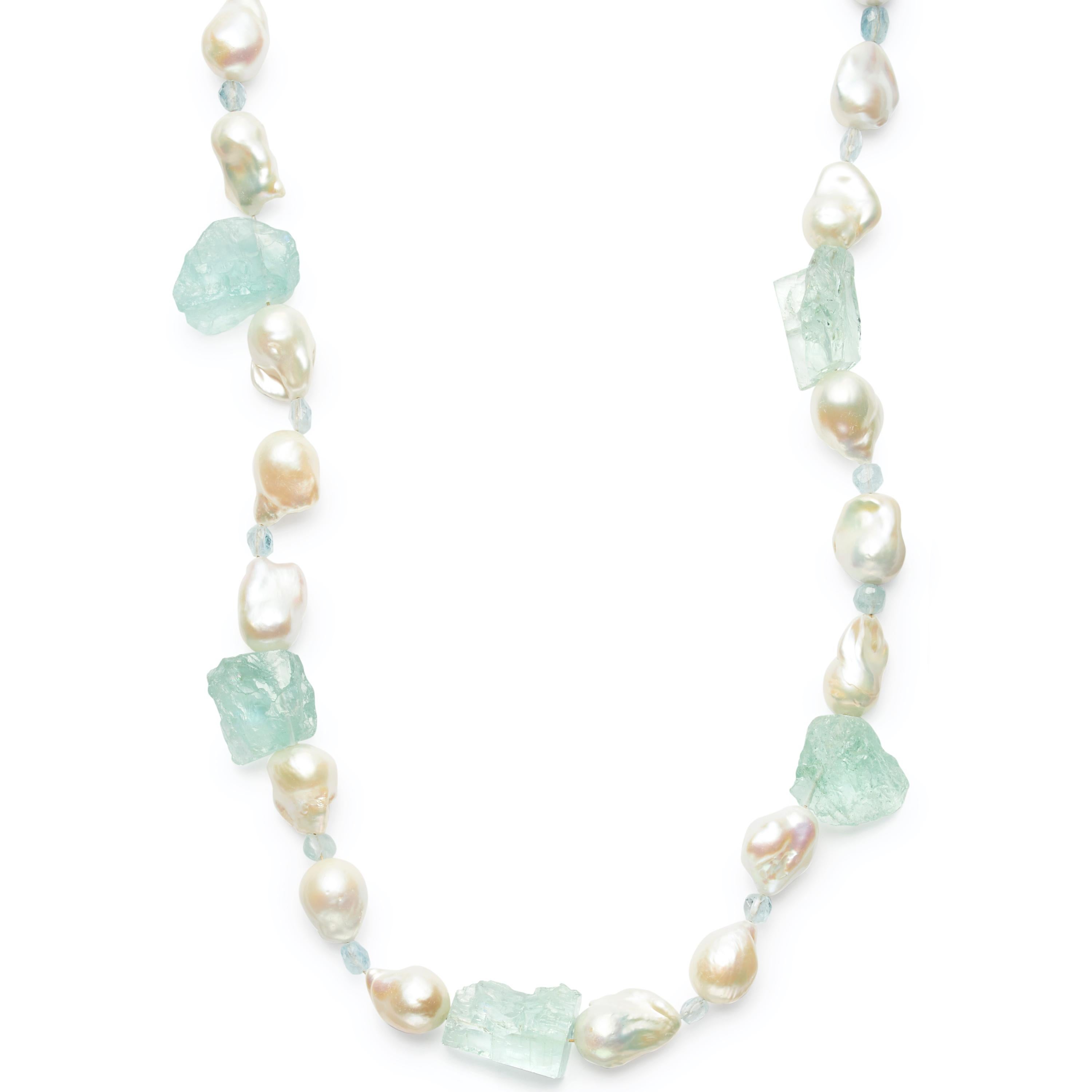 A stunning 32-inch statement strand of chunky Freshwater Pearls mixed with icy, Mirror Cut Aquamarine and 18 Karat Gold Rondelles.  Wear alone or layered. Secured with an 18 Karat Gold clasp.

