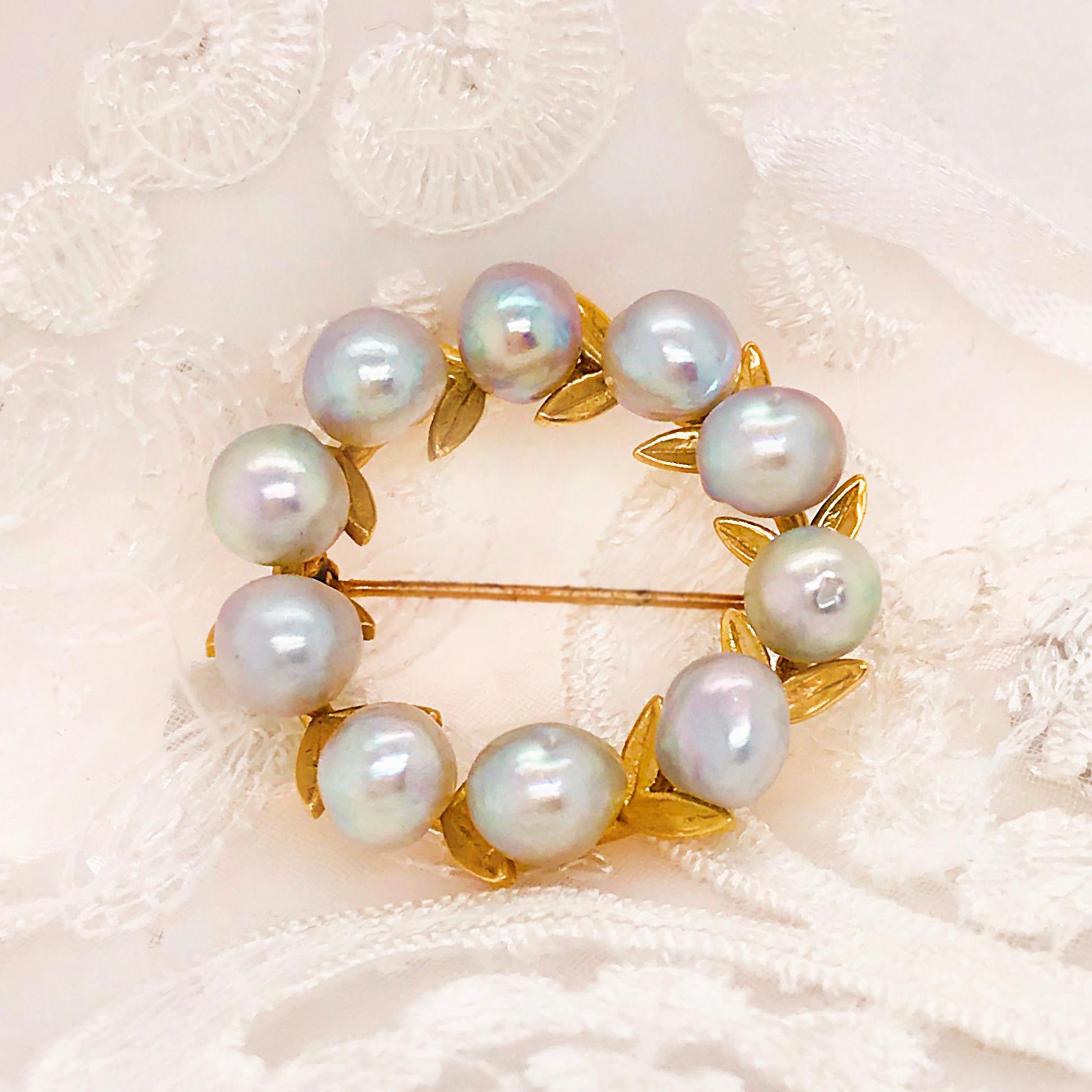 This is a beautiful blue freshwater pearl brooch that has a romantic floral design. With 10 freshwater pearls mounted on a custom golf leaf design. The pearl wreath pin/brooch is so precious and has great quality pearls with a very unique color.