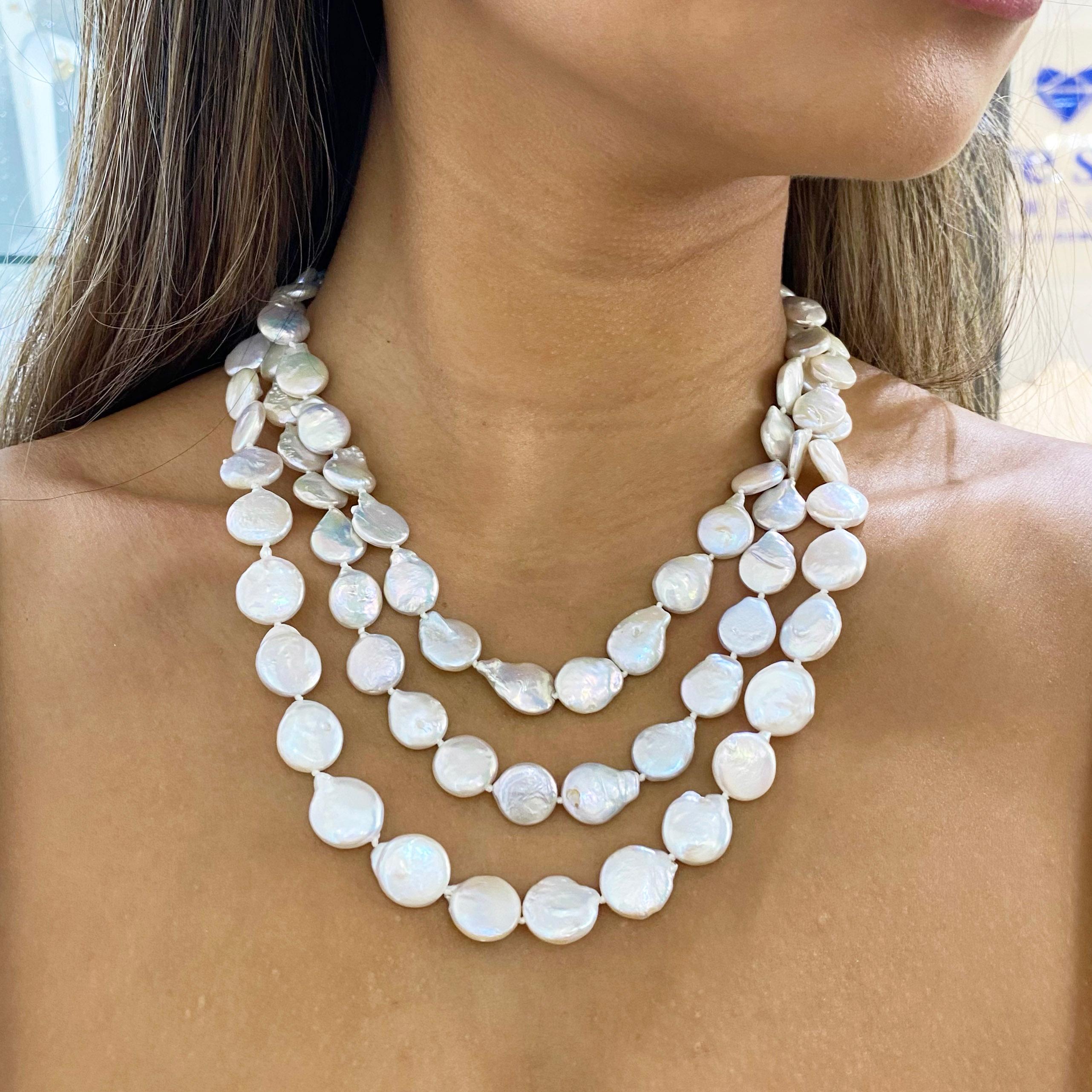 This beautiful, multi-stranded pearl necklace is a unique piece. These are freshwater, coin pearls that give off an iridescent shine. Feel classy and glamorous as your freshwater, coin pearls shine around your neck. 

The details for this beautiful