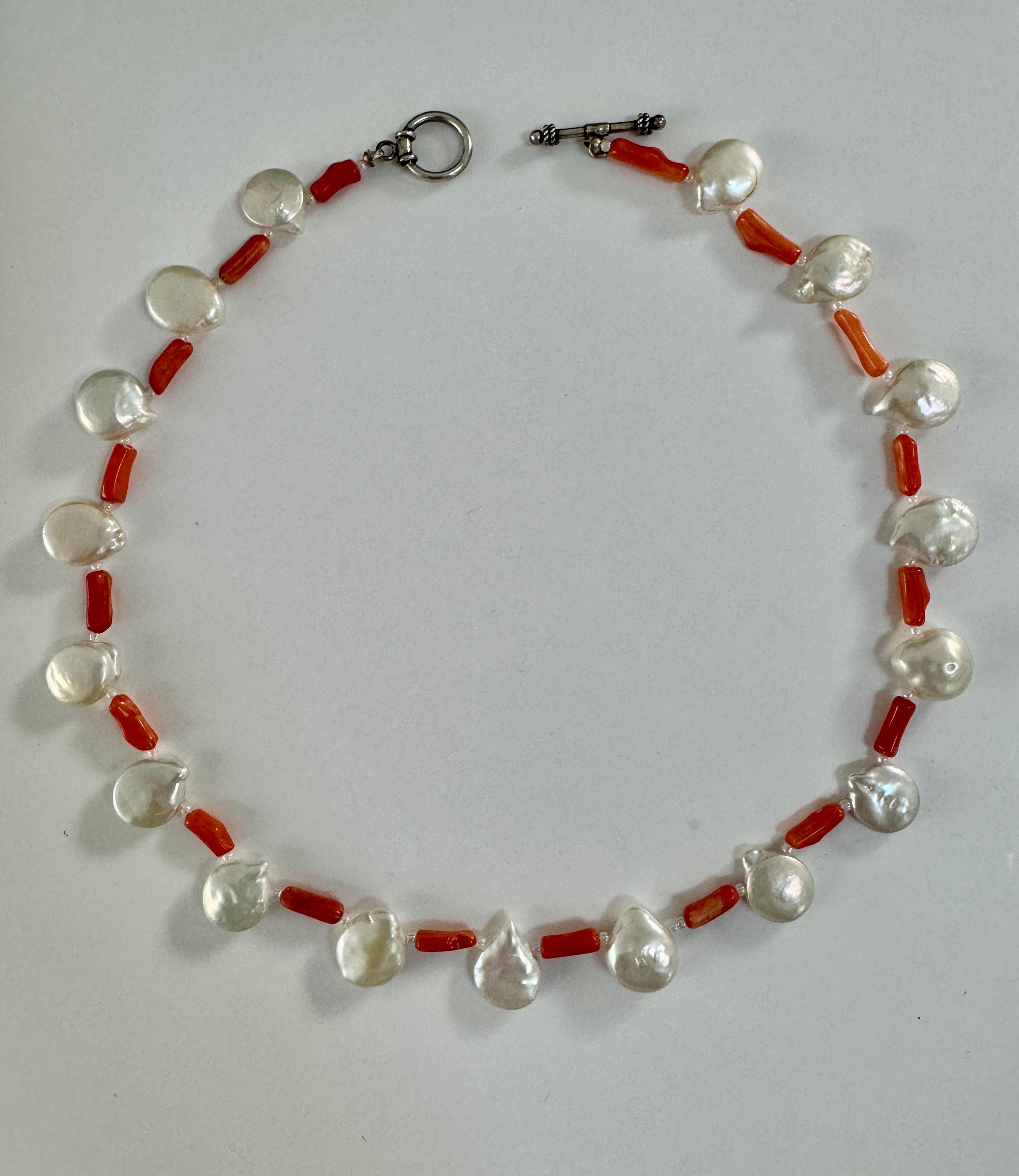 Freshwater Oyster Pearl and Coral Necklace
Handmade one of a kind delicate natural white luster round oyster pearls with salmon color stick coral, and small seed pearls, sterling silver clasp. About 16