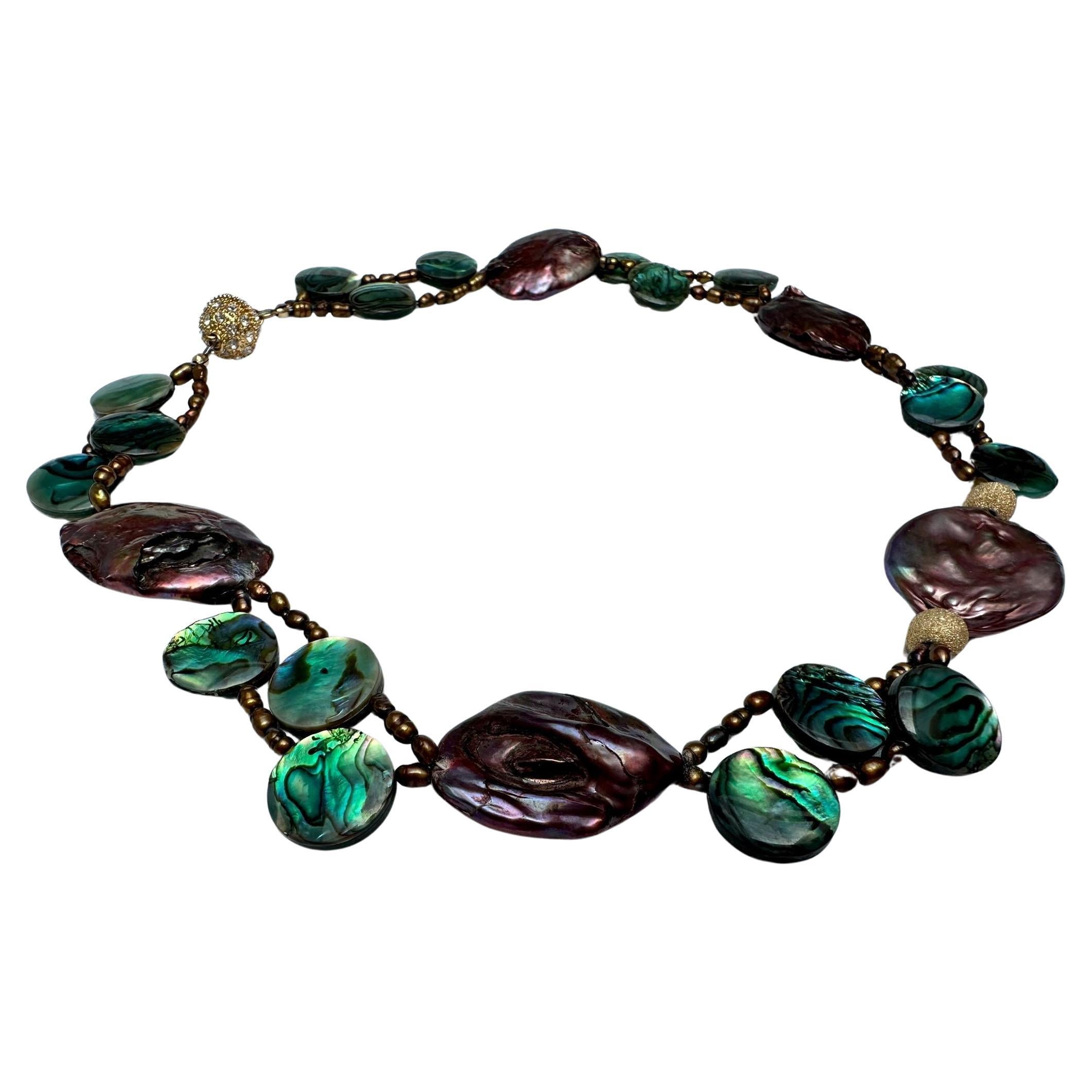 Freshwater Cultured Pearl Abalone Necklace 
One of a kind statement necklace designed with luster baroque oval brown pearls, small rice pearls and green abalone shell round beads. Strong magnetic clasp, about 17