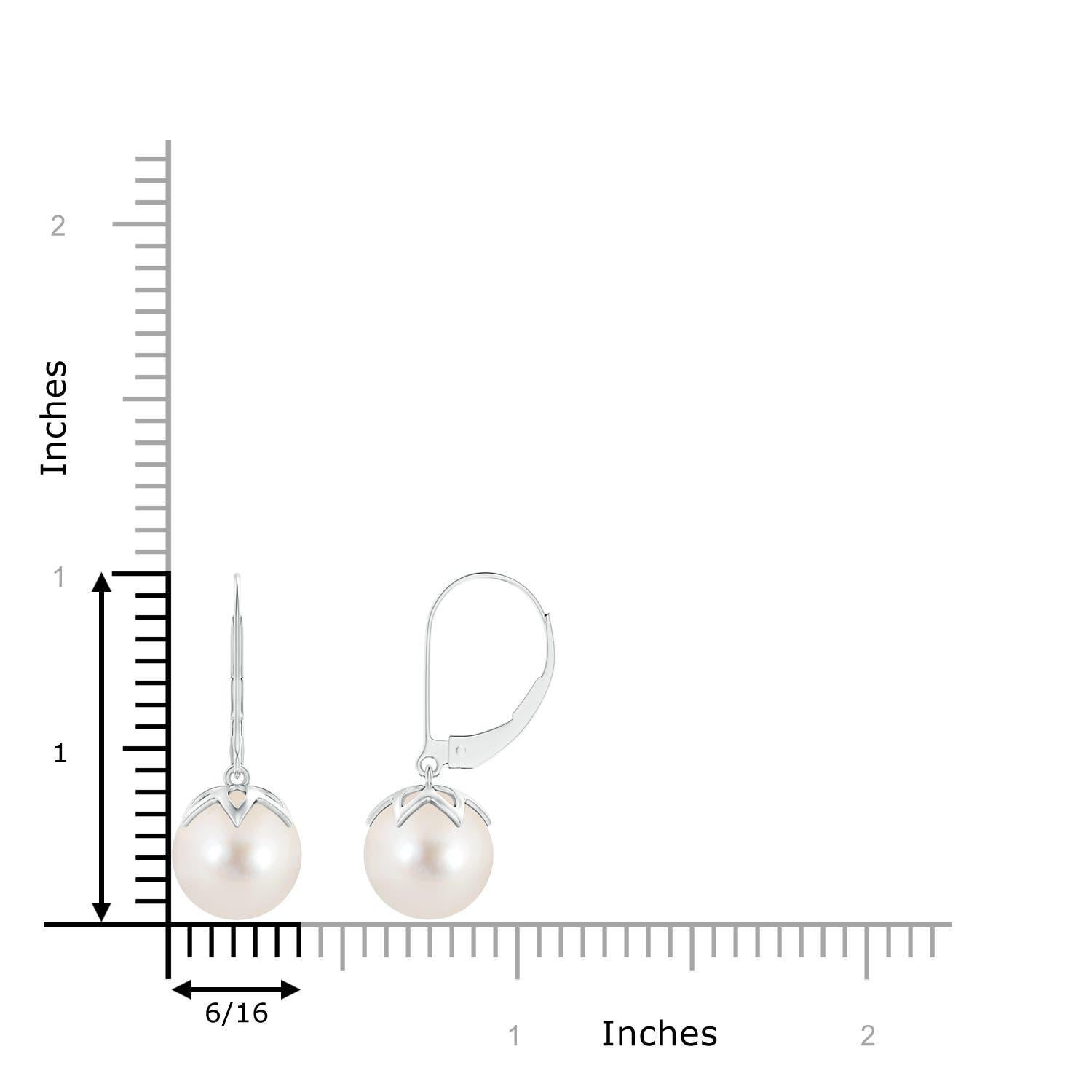The classic white of the two round peg-set Freshwater cultured pearls is sure to allure. Crafted in 14K white gold, these dangling pearl earrings will give you a polished look for the day as well as the night. Match these pearl ball drop earrings