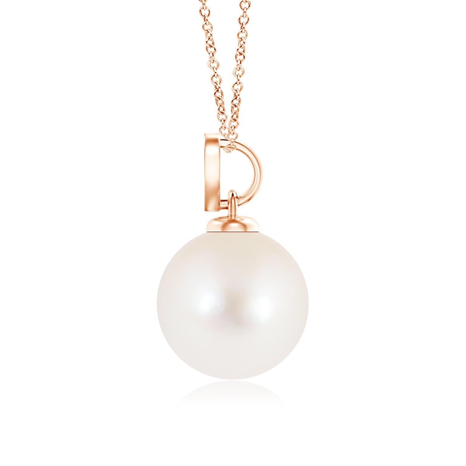 Nothing connotes love better than this charming diamond heart pendant in 14K rose gold. It features a round Freshwater cultured pearl that illuminates with its delightful hue, while the diamond studded heart motif adds a romantic touch to the