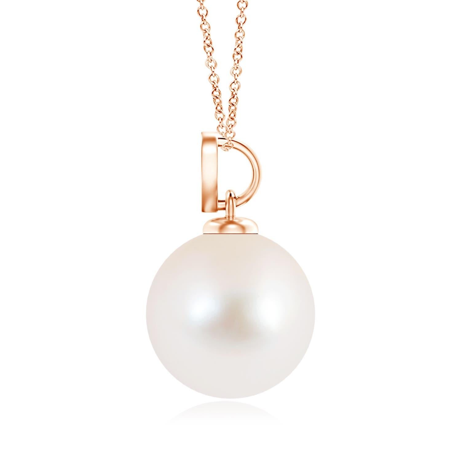 Nothing connotes love better than this charming diamond heart pendant in 14K rose gold. It features a round Freshwater cultured pearl that illuminates with its delightful hue, while the diamond studded heart motif adds a romantic touch to the
