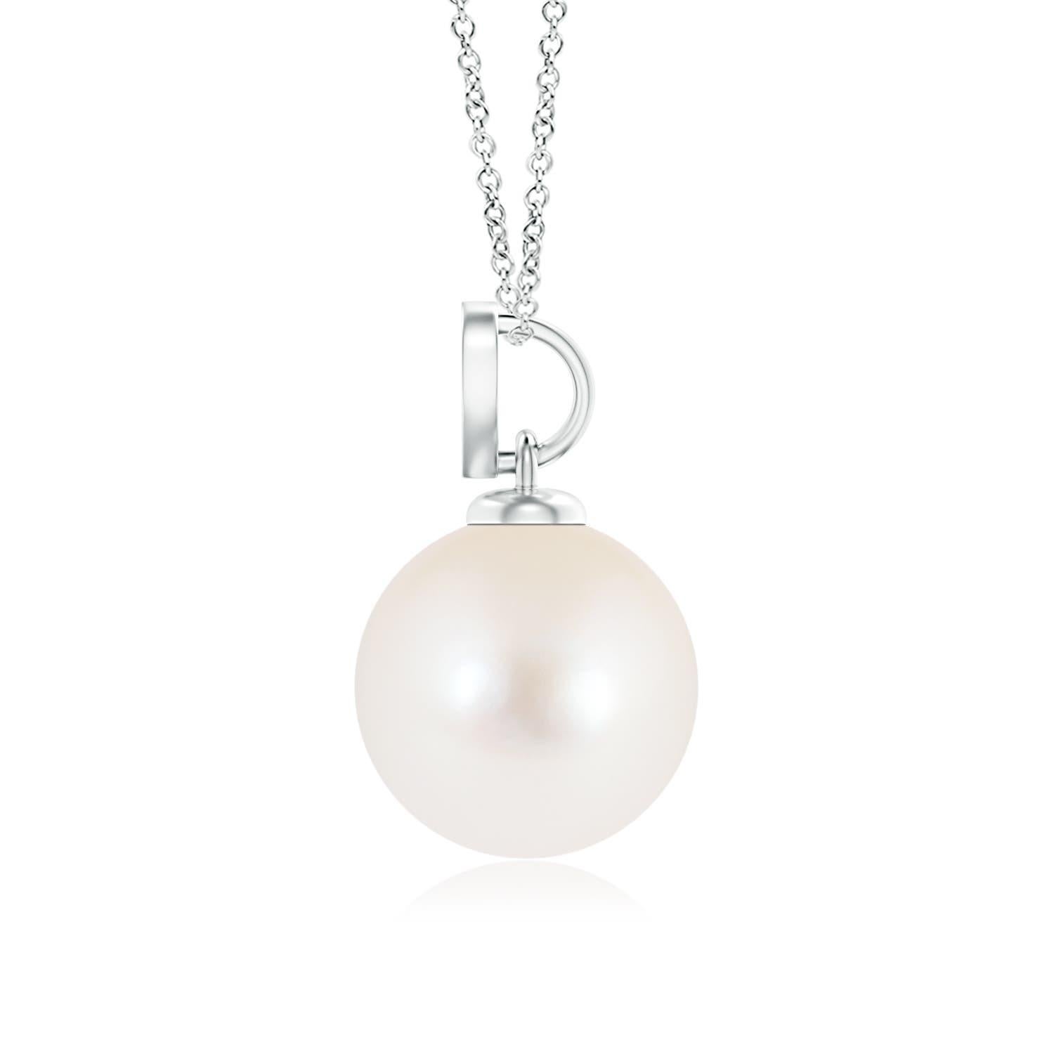 Nothing connotes love better than this charming diamond heart pendant in 14K white gold. It features a round Freshwater cultured pearl that illuminates with its delightful hue, while the diamond studded heart motif adds a romantic touch to the