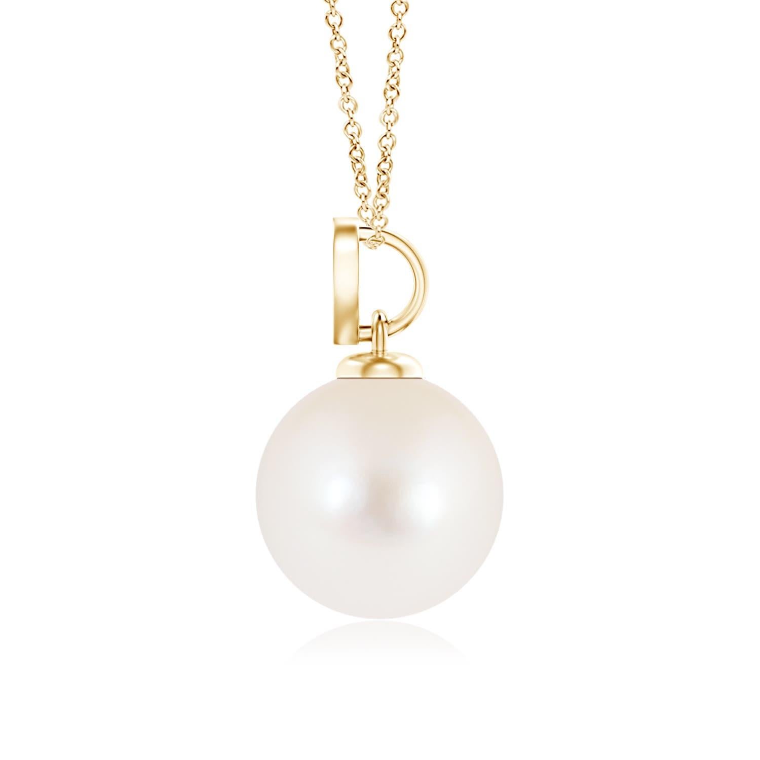 Nothing connotes love better than this charming diamond heart pendant in 14K yellow gold. It features a round Freshwater cultured pearl that illuminates with its delightful hue, while the diamond studded heart motif adds a romantic touch to the