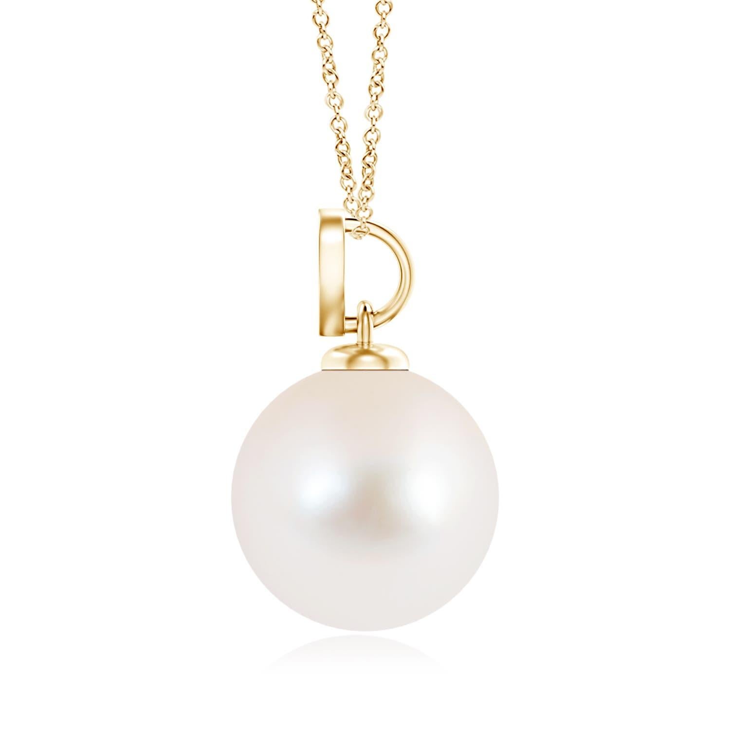 Nothing connotes love better than this charming diamond heart pendant in 14K yellow gold. It features a round Freshwater cultured pearl that illuminates with its delightful hue, while the diamond studded heart motif adds a romantic touch to the