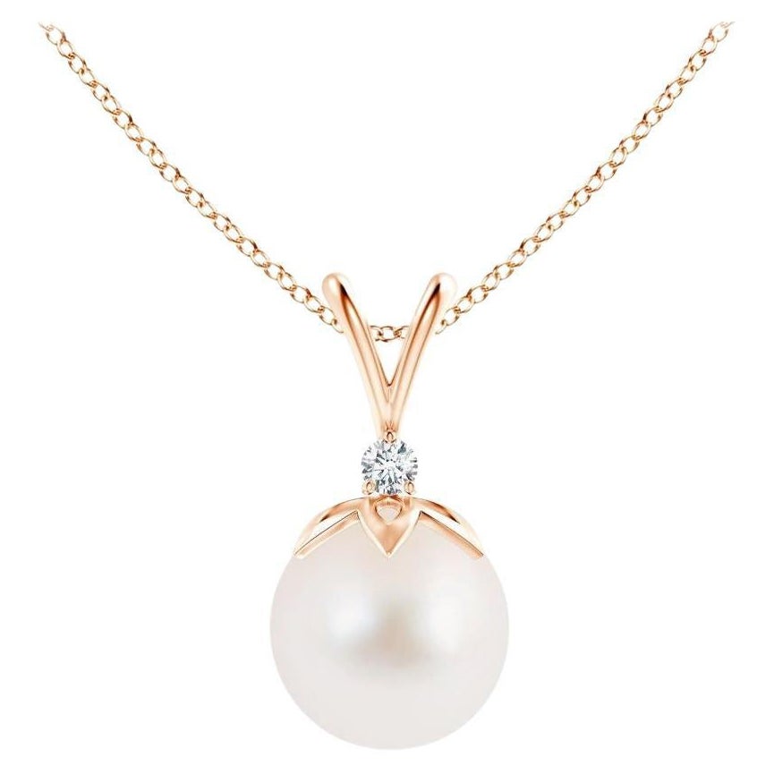 Ciondolo a forma di balla di perle coltivate d'acqua dolce con diamante in oro rosa 14 carati