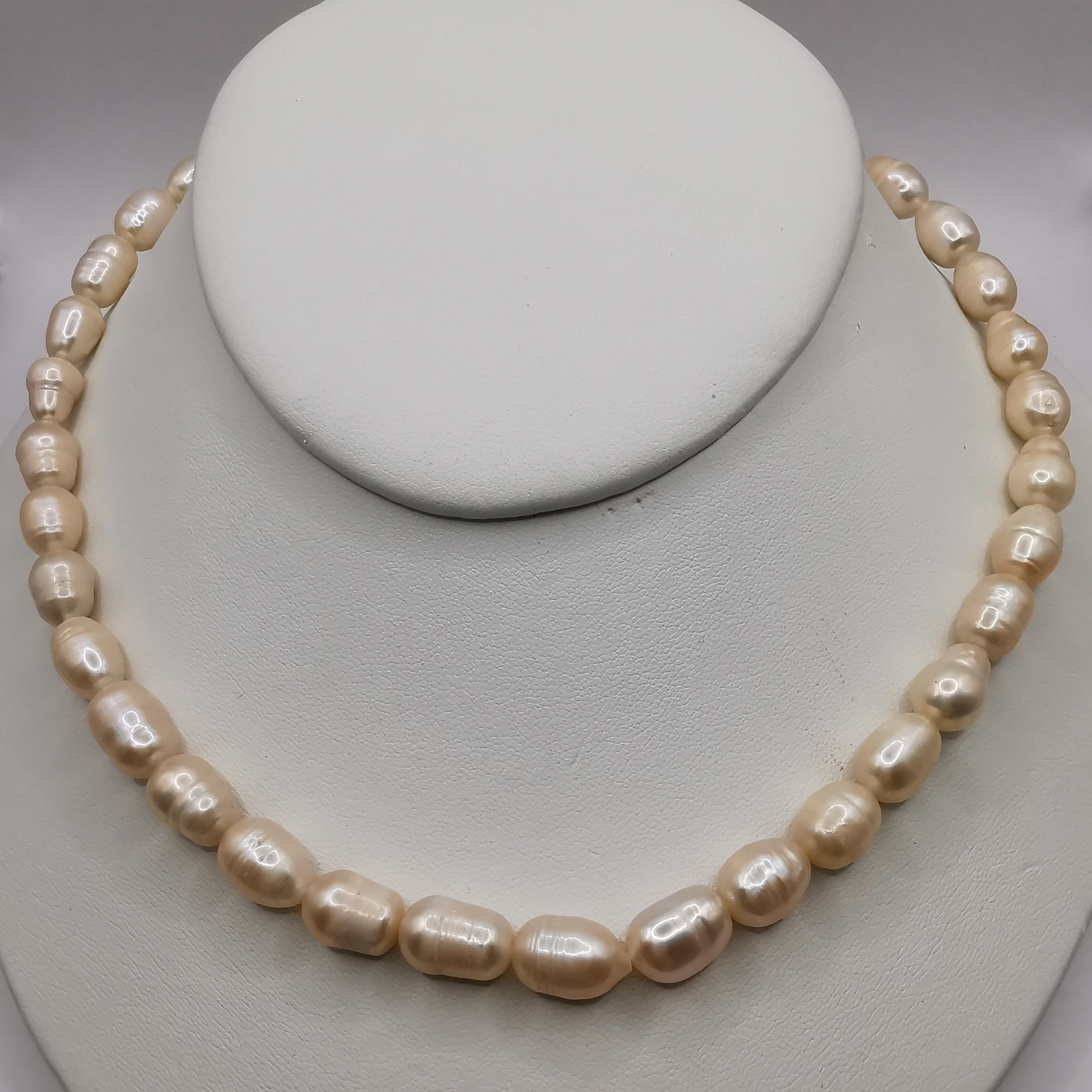 This beautiful freshwater cultured baroque pearl necklace is a perfect accessory for any occasion. The necklace features a strand of 36 freshwater cultured pearls that have a classic white color, which is sure to complement any outfit. The baroque