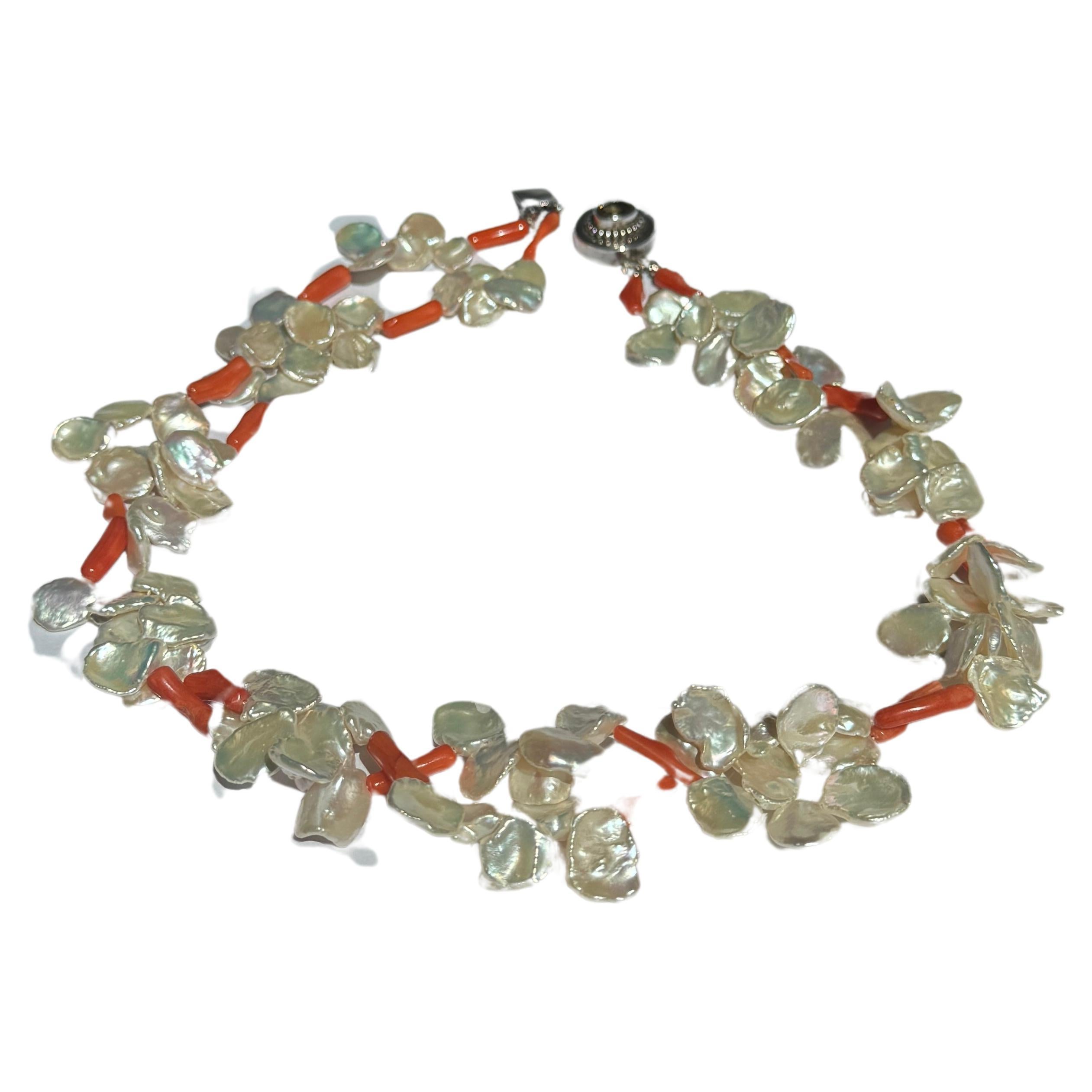 Freshwater Keshi Pearl Coral Two Strand Necklace
Handmade one of a kind natural white luster keshi pearls with salmon coral, sterling silver clasp decorated with oval smoke quartz in the center.