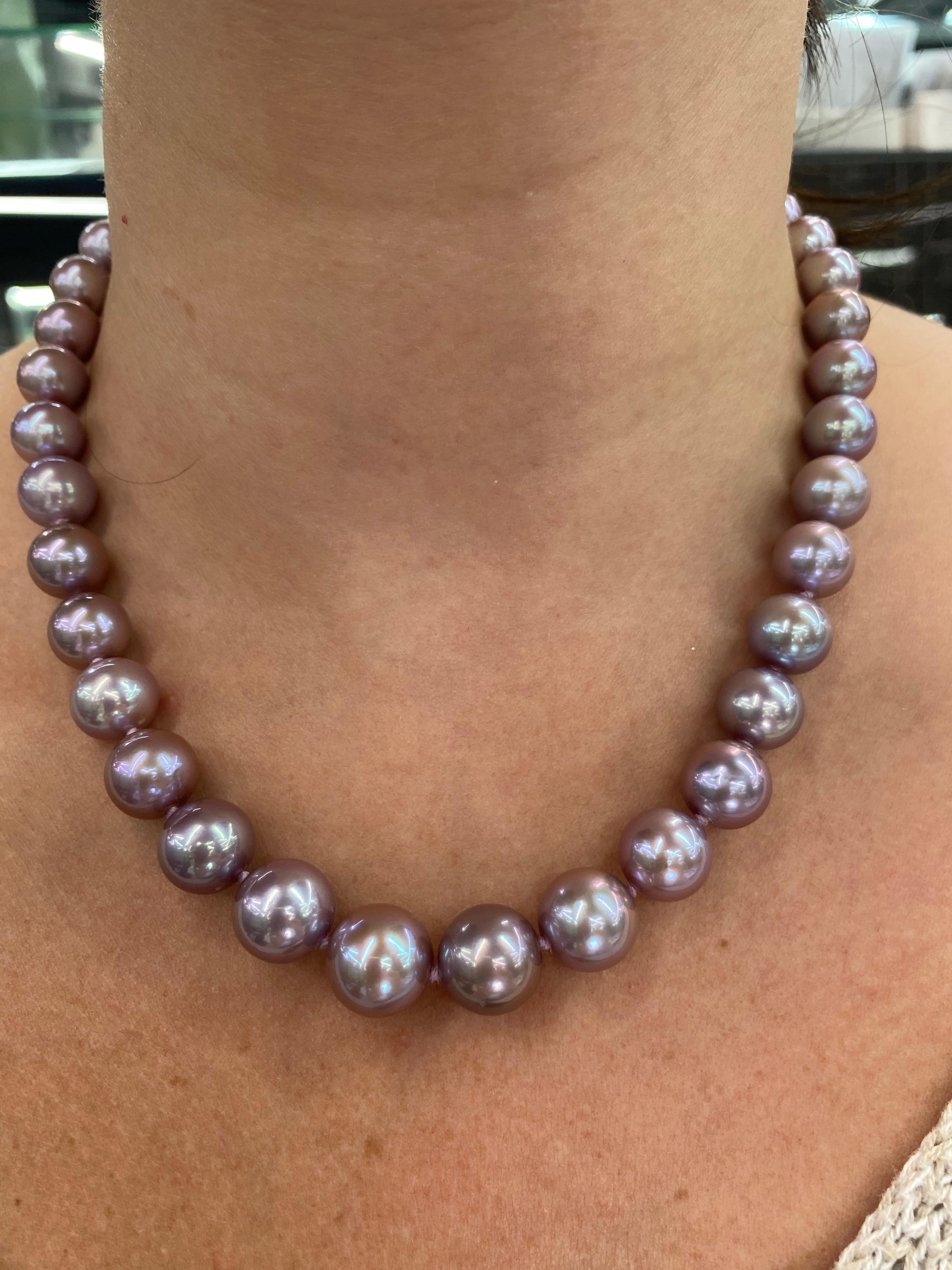 A lovely perfectly matched pearl strand necklace featuring 38 Freshwater Lavender Pearls measuring 10-13 mm with a high polish ball clasp in 14K White Gold. 

Pearl quality: AAA
Pearl Luster: AAA Excellent
Nacre : Very Thick

Strand can be made to