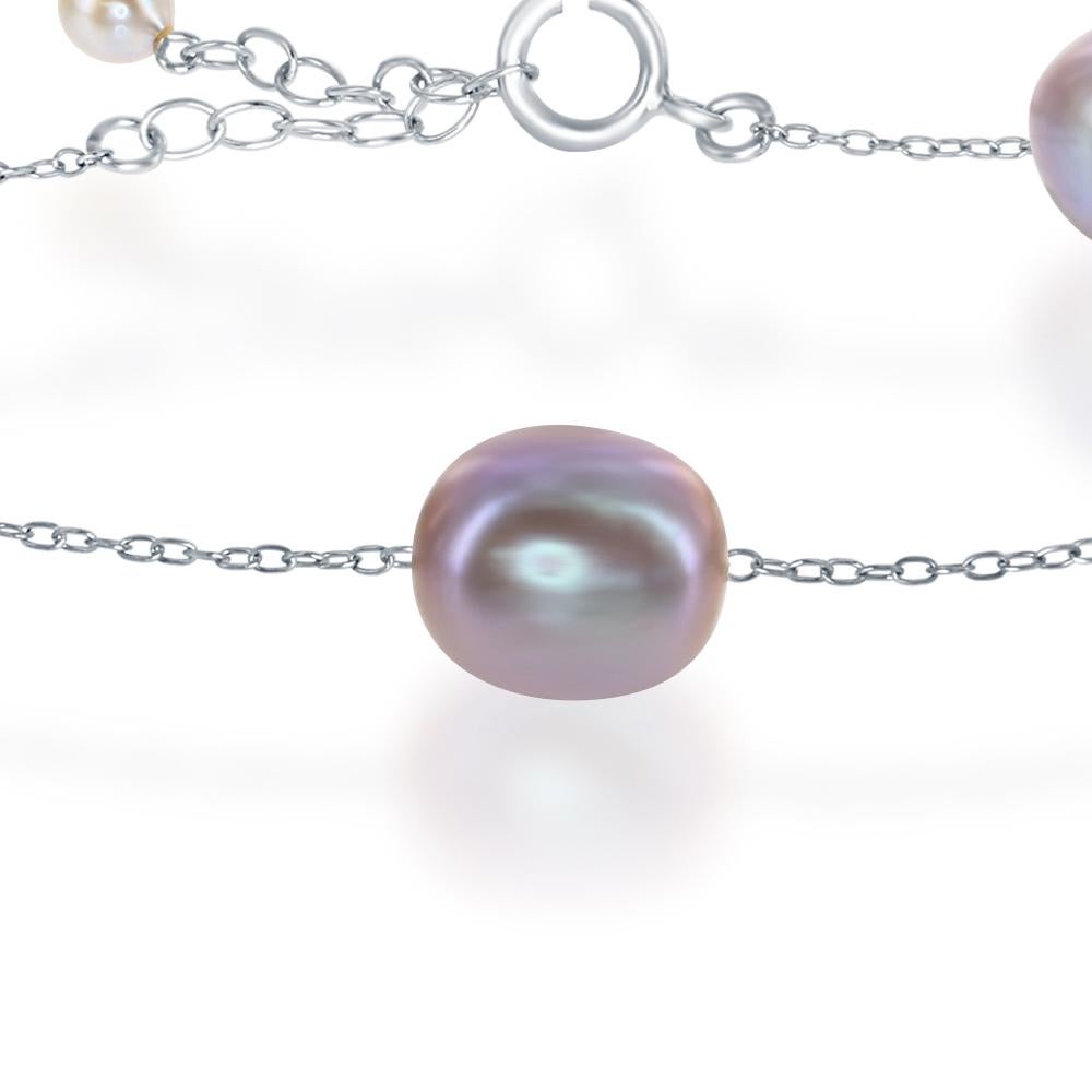 This tin-cup style sterling silver bracelet features cultured freshwater, natural color pink, oval 9-10mm pearls. The bracelet can be worn at either 7 or 8 inches.  