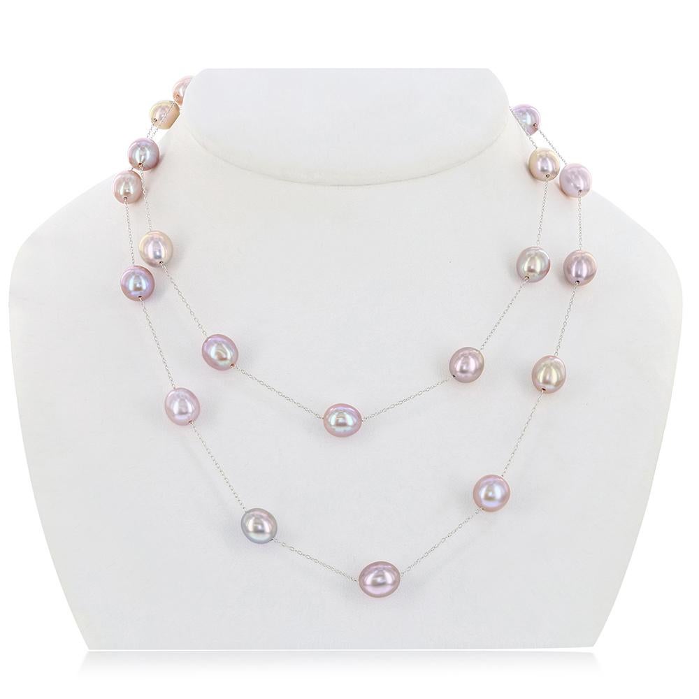 This double length tin-cup style necklace features oval shaped cultured freshwater natural pink color pearls. The pearls measure 9-10mm. This necklace measures 36 inches and can be worn as a long strand or doubled-up. 