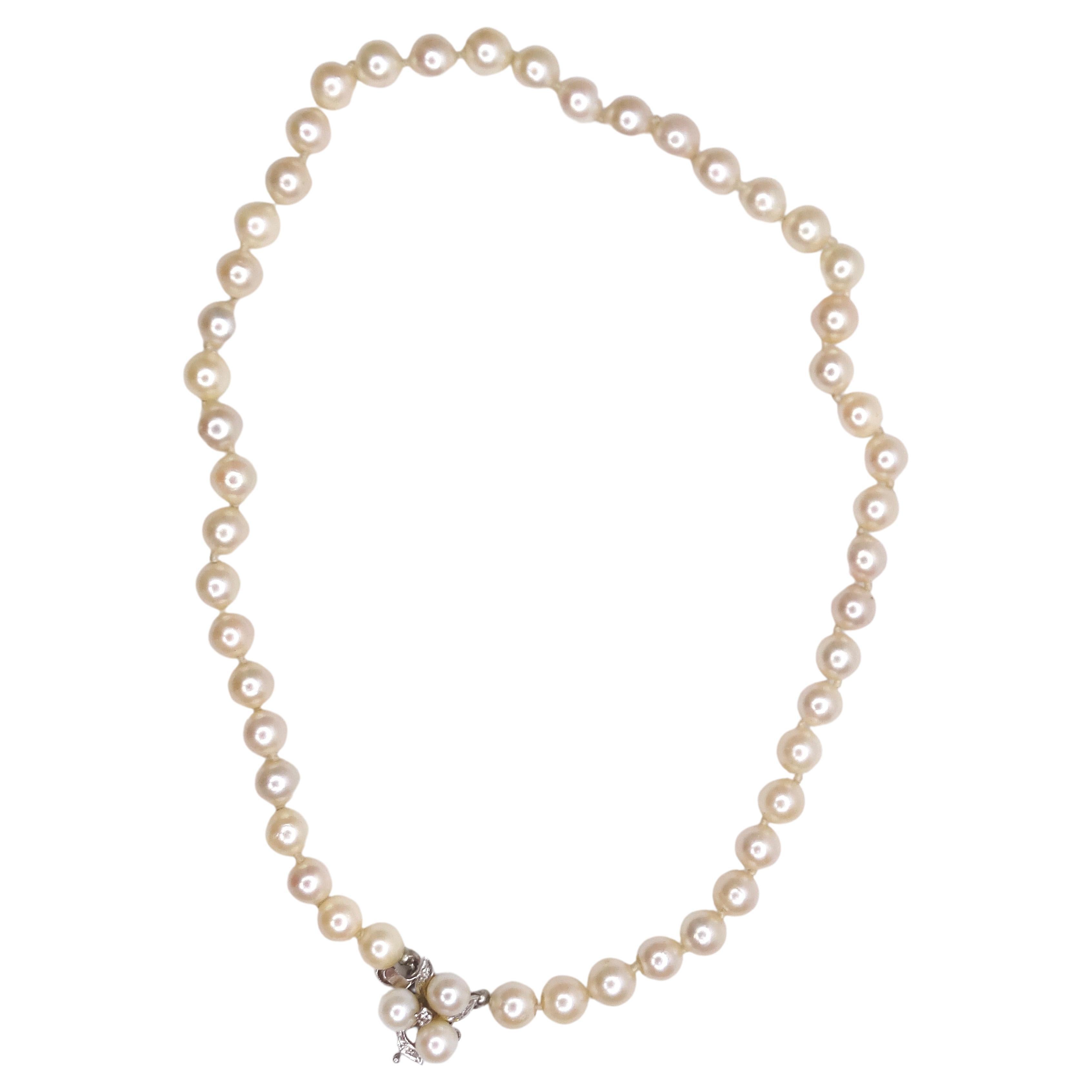 Get your pearls, darling! Feel your best with freshwater pearls draped on your neck. Don't miss the great details of this necklace as it has a three-pearl pendant with four diamonds and delicate leaf detailing clip that is 14K white gold. Pair with