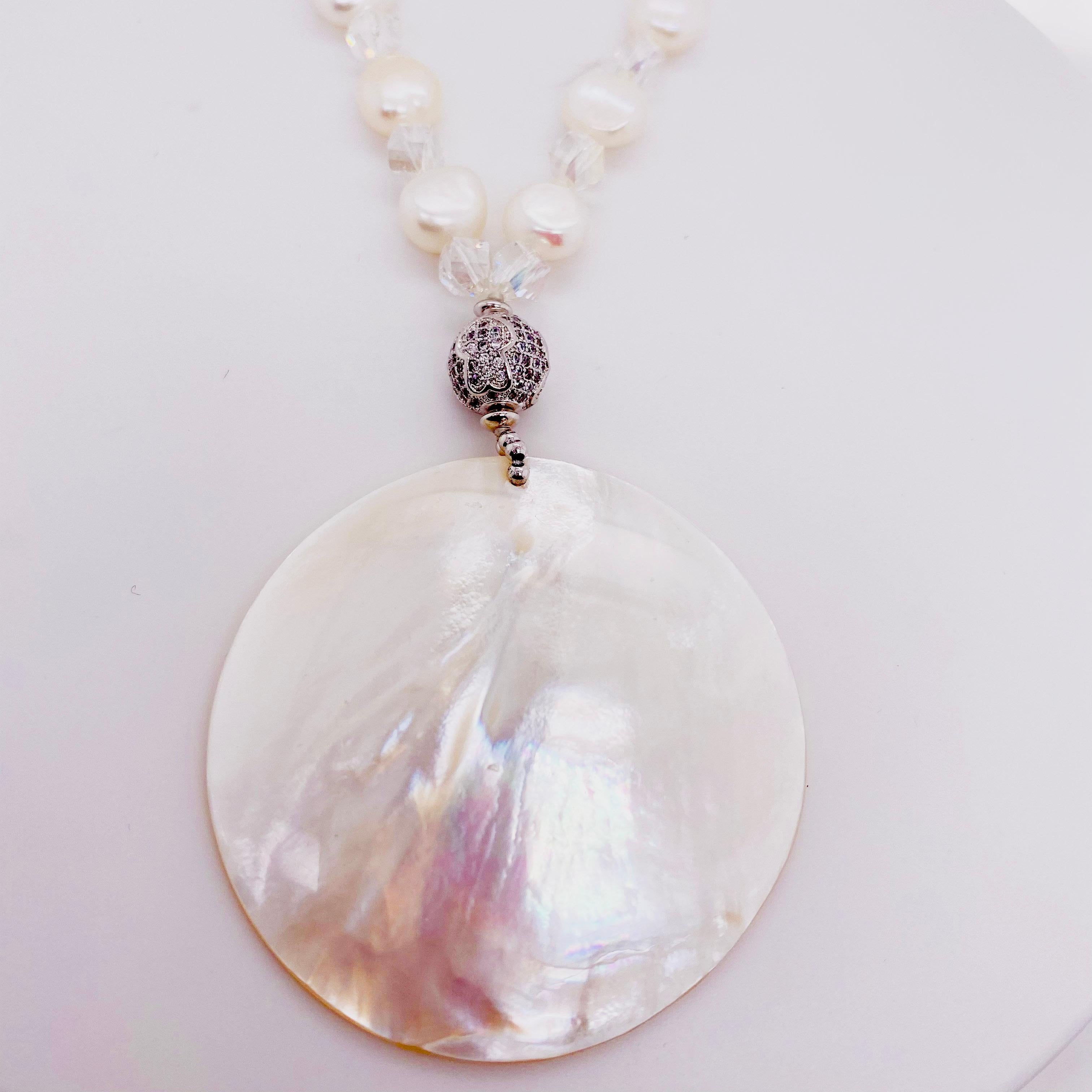 The necklace makes a gorgeous statement! The beautiful white pearls are paired with mother-of-pearl, and sterling silver beads. At thirty-three inches the necklace hangs so nicely and hits just perfectly! The details for this beautiful necklace are