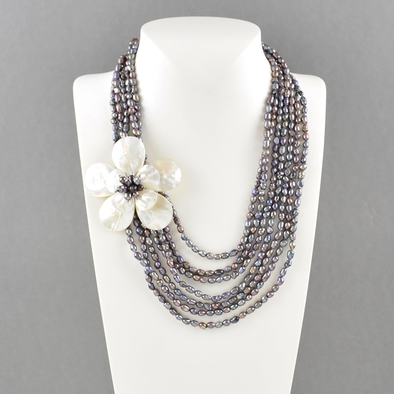 Elevate your private jewelry collection with this exquisite multi-strand freshwater pearl choker, designed to captivate. A breathtaking blend of shimmery gray, black, and smoky pink rice seed pearls creates a luminous, sophisticated aesthetic. The