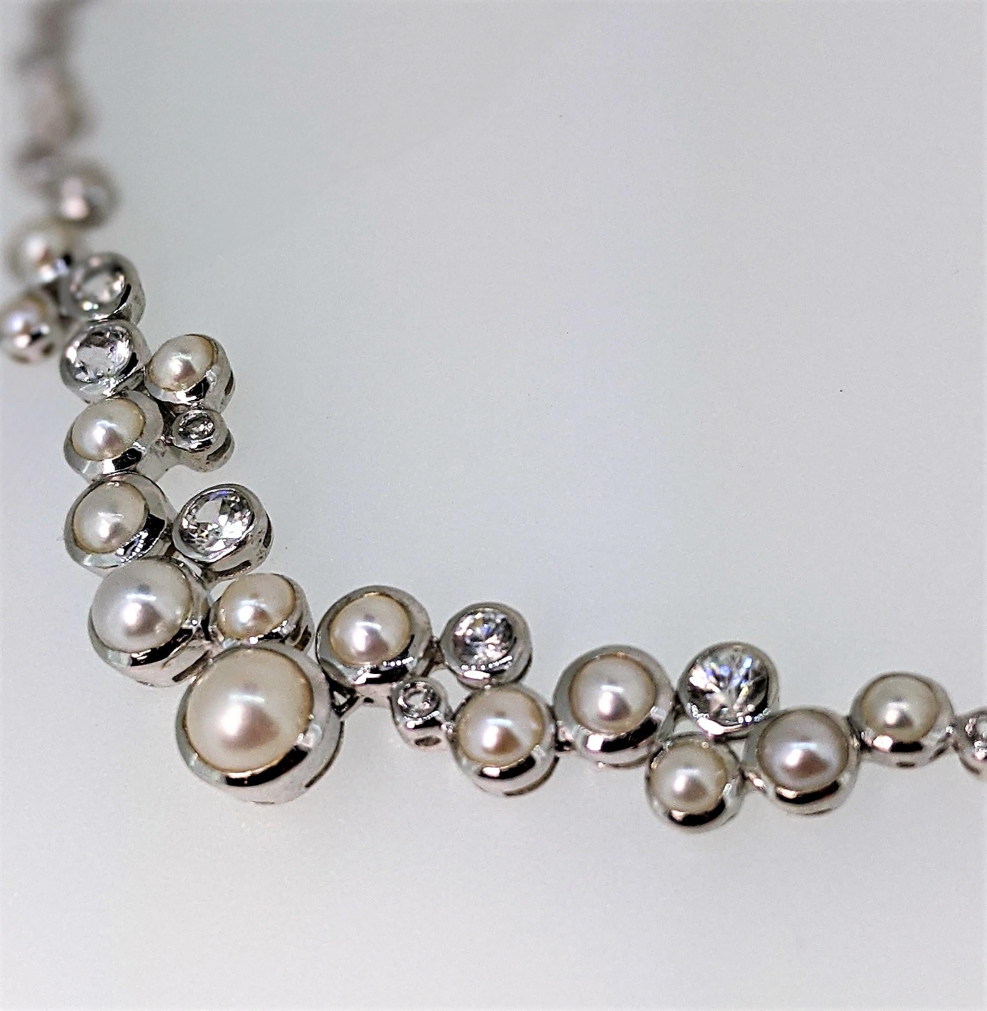 From the Shooting Stars collection, this is the Constellation necklace is in sterling silver with lovely natural and white freshwater pearls and sparkling zircon (These are NOT lab created cubic zirconium stones, but real stones - and they honestly