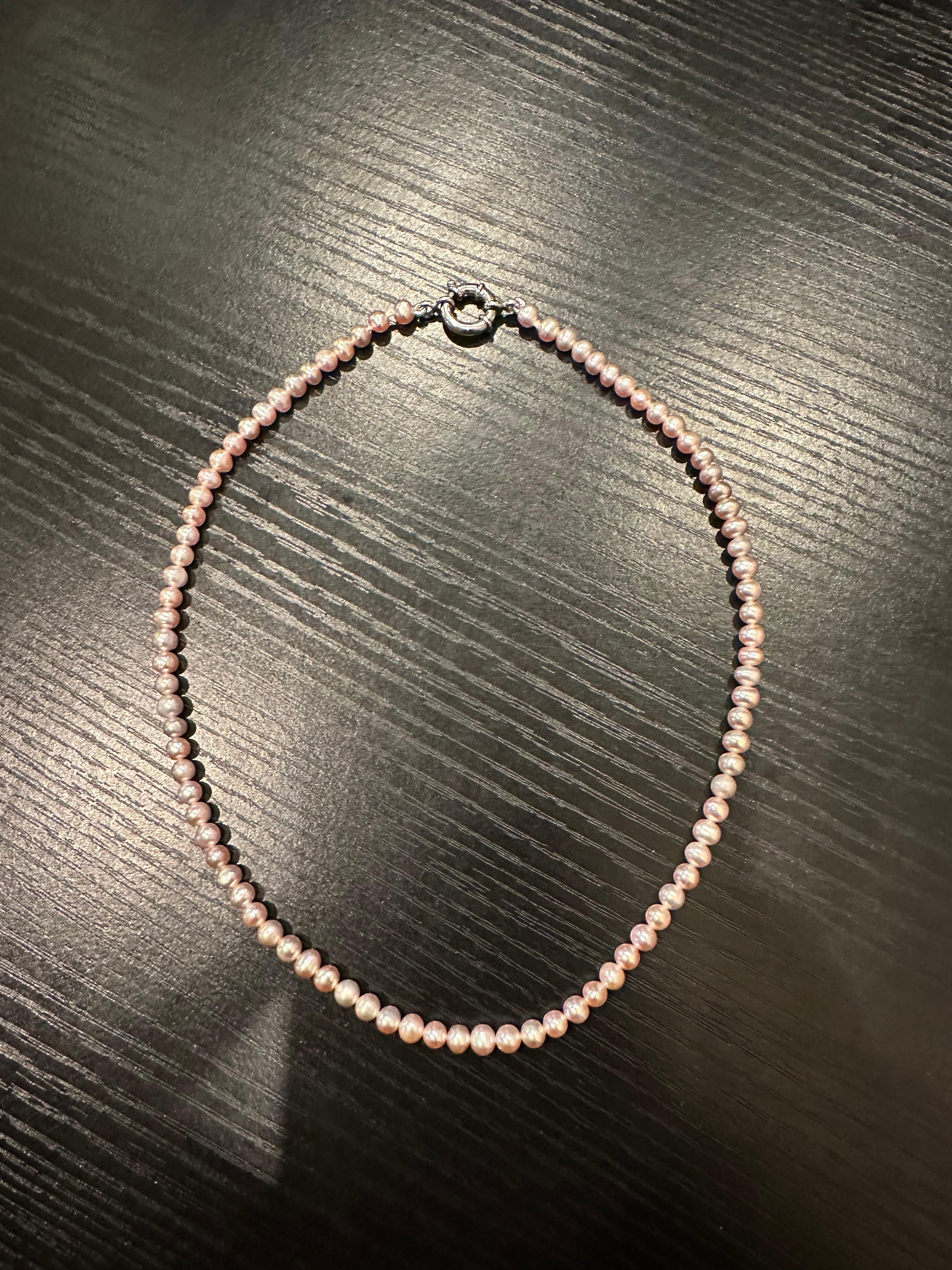 Stunning pink pearl choker with a sterling silver stamped 925 clasp, very elegant, comes with box, certificate of authenticity and nicely packaged! Its 16 inches.

ABOUT US
We are a family-owned business. Our studio in located in the heart of Boca