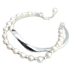 Bracelet en argent avec perles d'eau douce et double arc