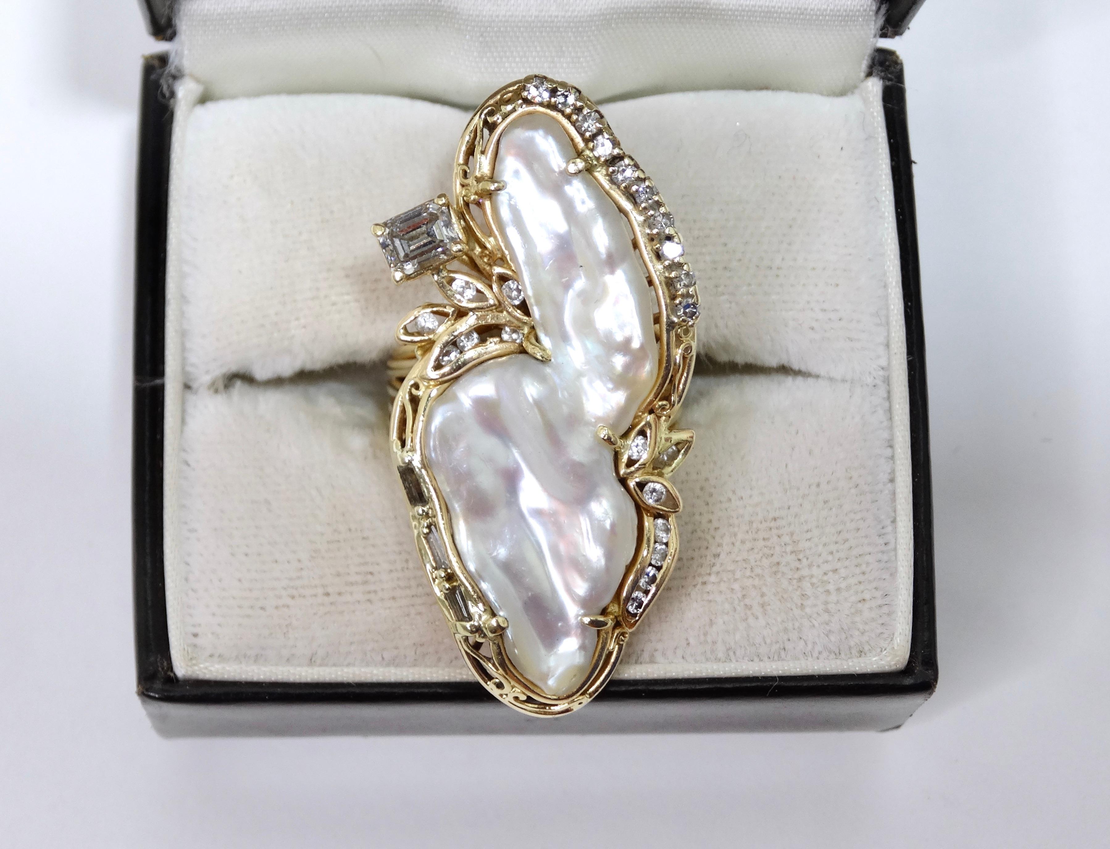 This is a highly designed and unique ring you need in your collection! Don't miss the chance to have a one-of-a-kind freshwater pearl ring. This ring is composed of 18k gold with a large freshwater pearl  as the centerpiece surrounded by small