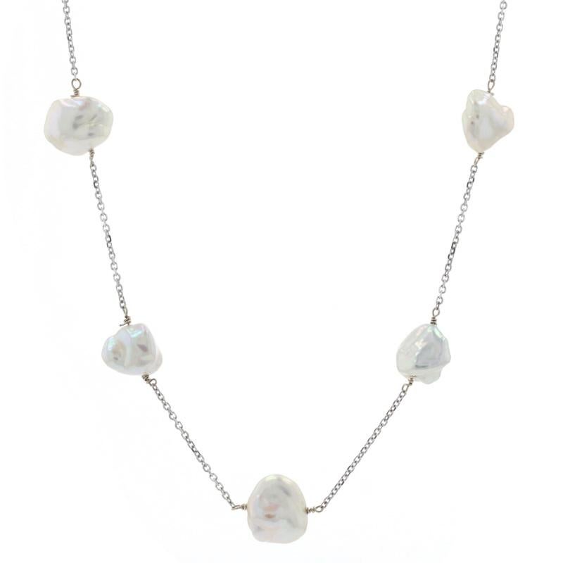 Chic and sophisticated, this gorgeous piece will ensure the special woman in your life steps out in style! This 14k white gold cable chain necklace is graced with twenty-three freshwater pearls that glow brilliantly in the light for a captivating