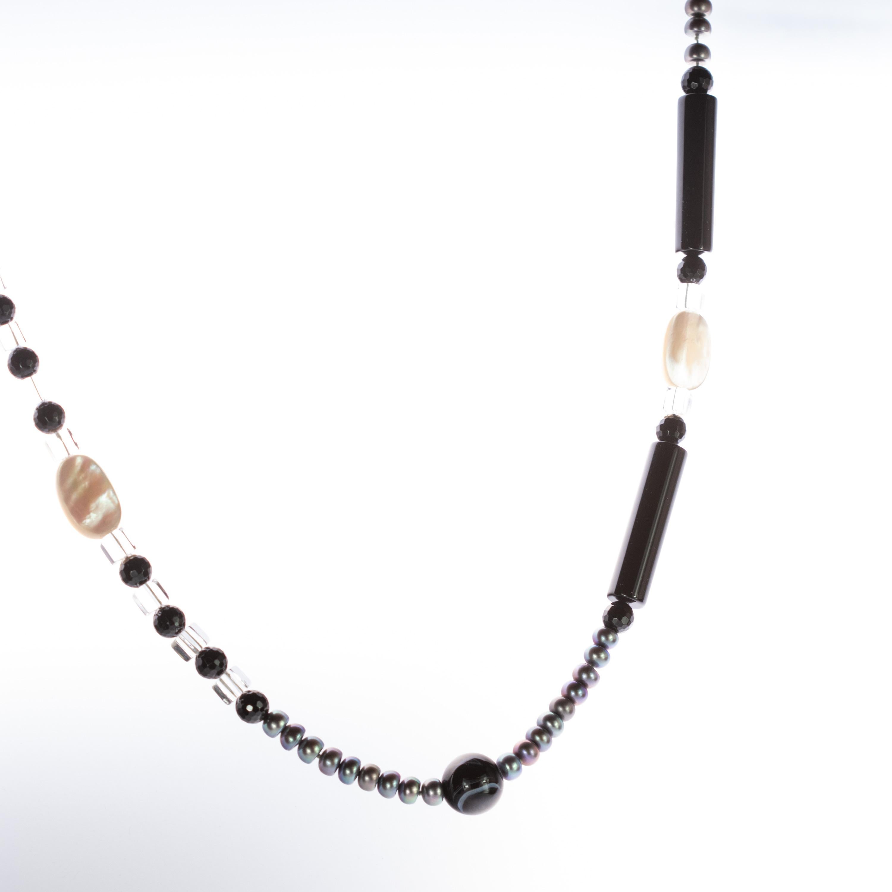 Rare and stunning spindly necklace with a strand of faceted black and white freshwater pearl, rock crystal and mother of pearl  Timeless modern and magnificent design with fabulous tube, round and uncut beaded and boho touch that gives an