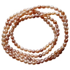 Freshwater Pearl Stand Shades of Pink Peach Pearls Very Good