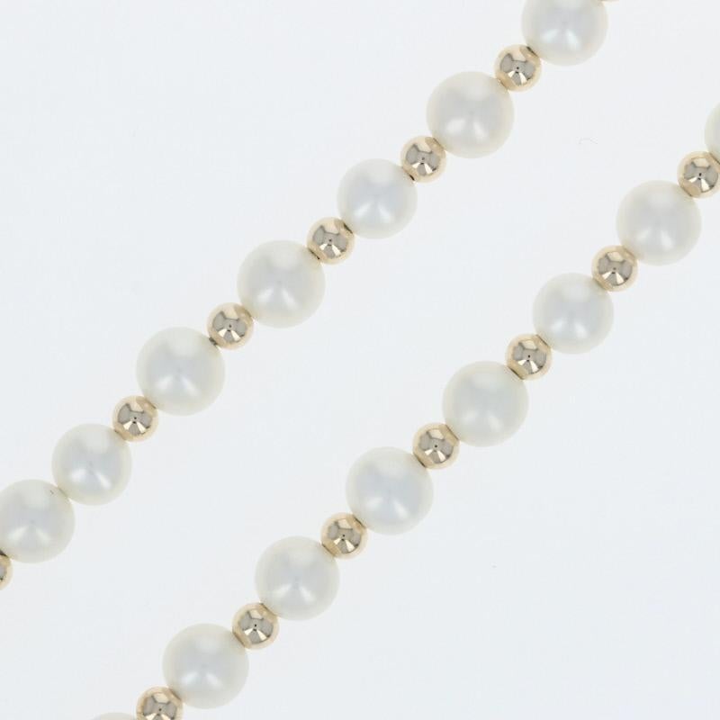 Metal Content: Guaranteed 14k Gold as stamped

Stone Information:
Freshwater Pearls - 

Chain Style: Beaded Strand 
Chain: length 17