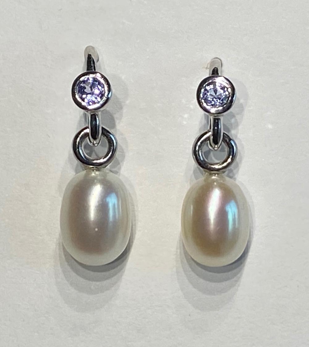 Women's A Pair of Pearl Dangle Earrings Accented with Tanzanites. For Sale