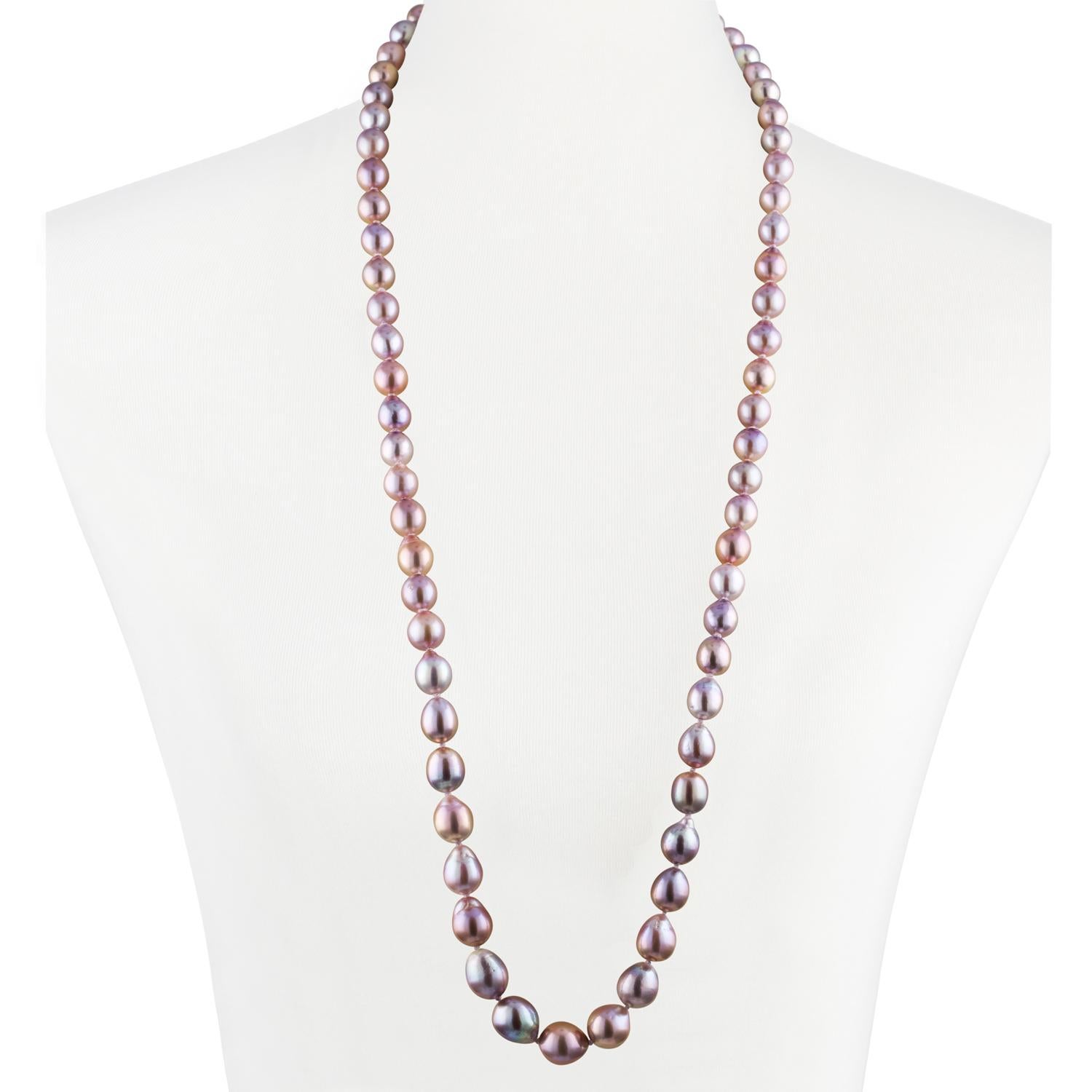 This Chinese Freshwater natural-color pink baroque necklace  features bright, fine quality, high luster pearls measuring 9.9x14.2mm. 
The double length necklace is strung to 36 inches in length and is strung with a 18K white gold 10mm ball