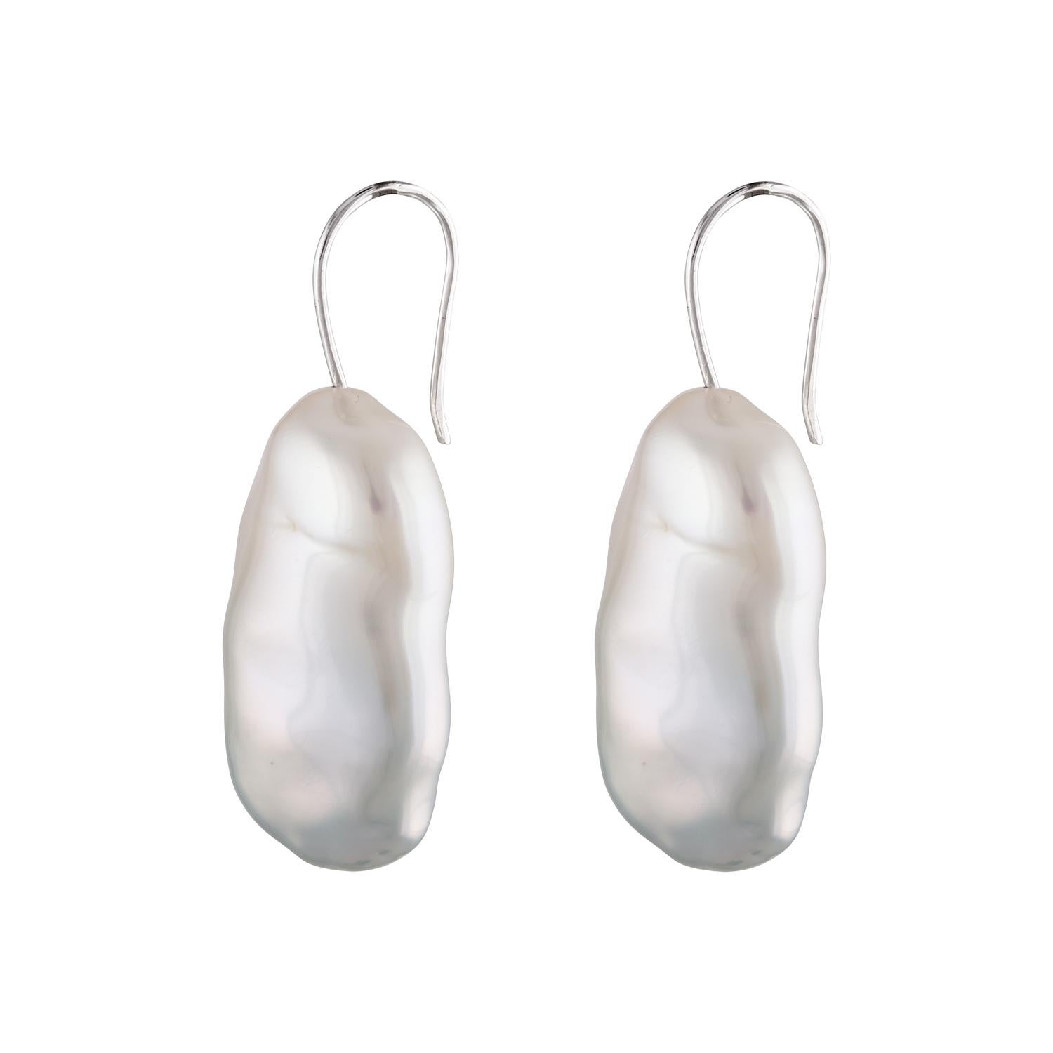 Simple, yet elegant, these Chinese Freshwater white Baroque cultured pearl earrings measure 15.6x29mm and are set on 14K white gold ear wires. 

The pearls are very well matched with great luster and elegant organic shapes. 

Perfect for weddings,