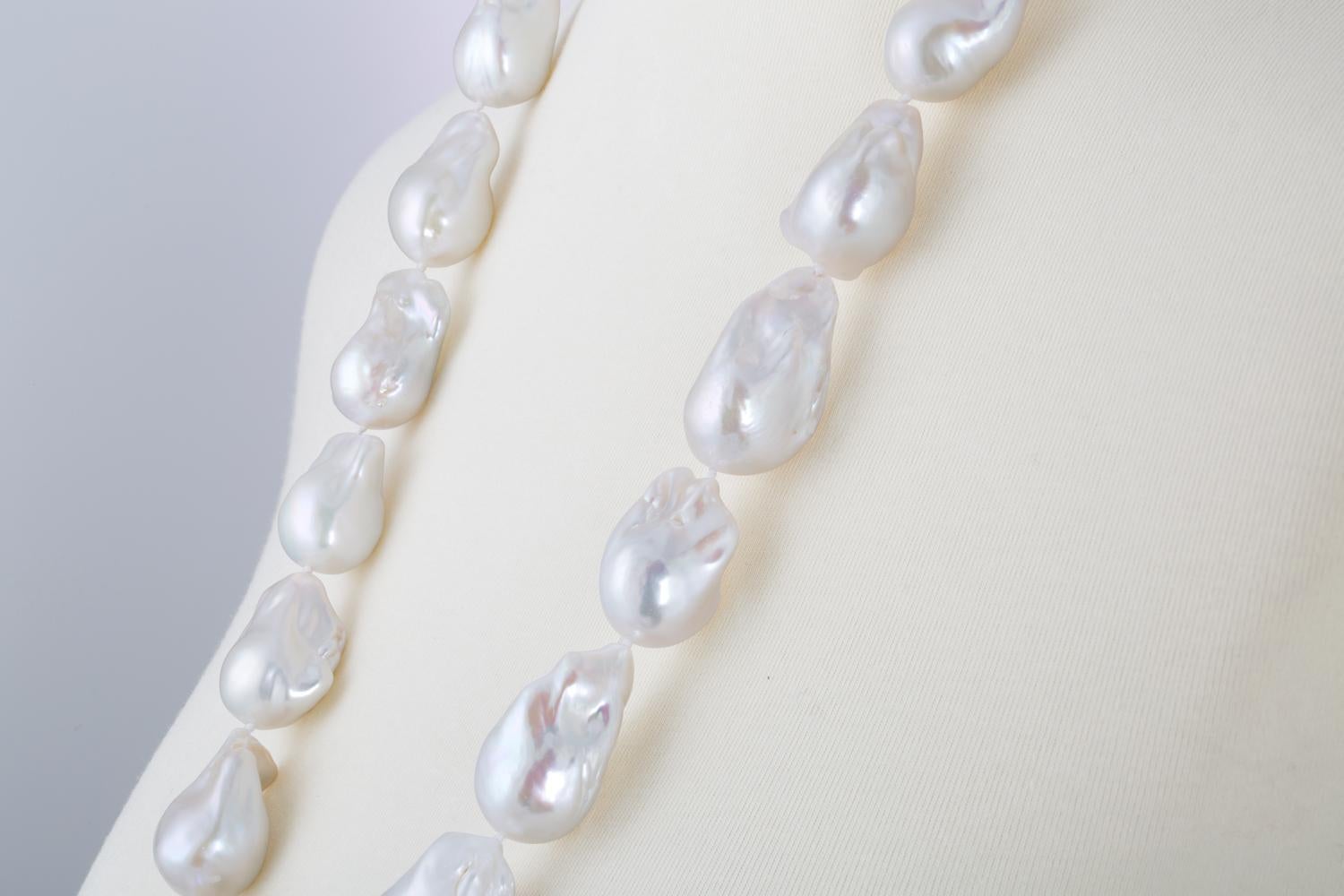 This necklace features Chinese Freshwater Baroque shaped pearl necklace measuring 18x20mm. These pearls are strung to 31 inches endless. These are among the largest Freshwater pearls that are cultivated. Alternative clasp options are available. The