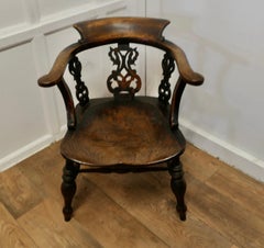 Fretwork Back Elm Windsor Desk Chair   This style is known by many names