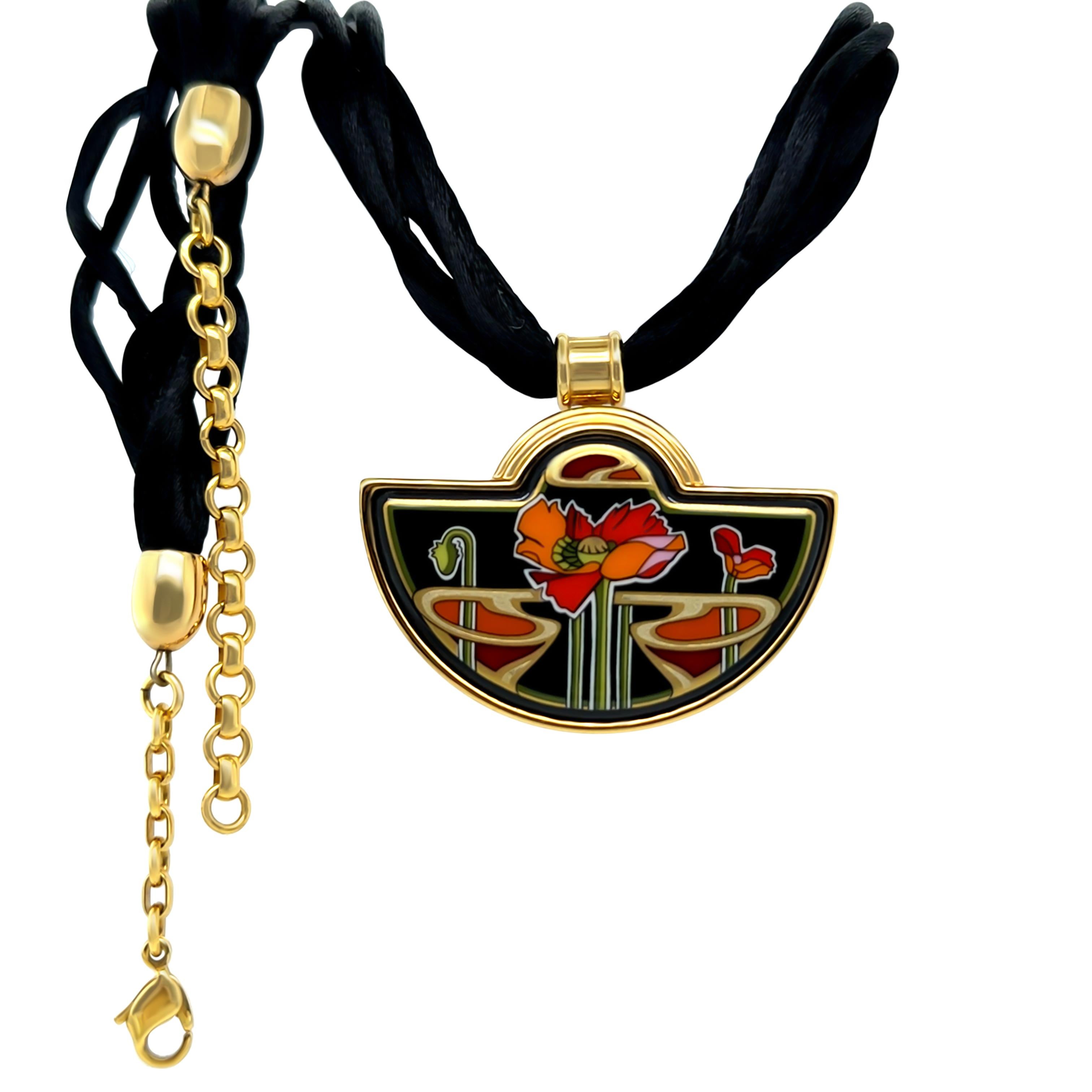 This exquisite Frey Wille set from the Alphonse Mucha Libussa Coral collection features a stunning combination of art and fine craftsmanship. The set includes a pair of oval clip-on earrings, a detachable pendant, and two interchangeable necklace