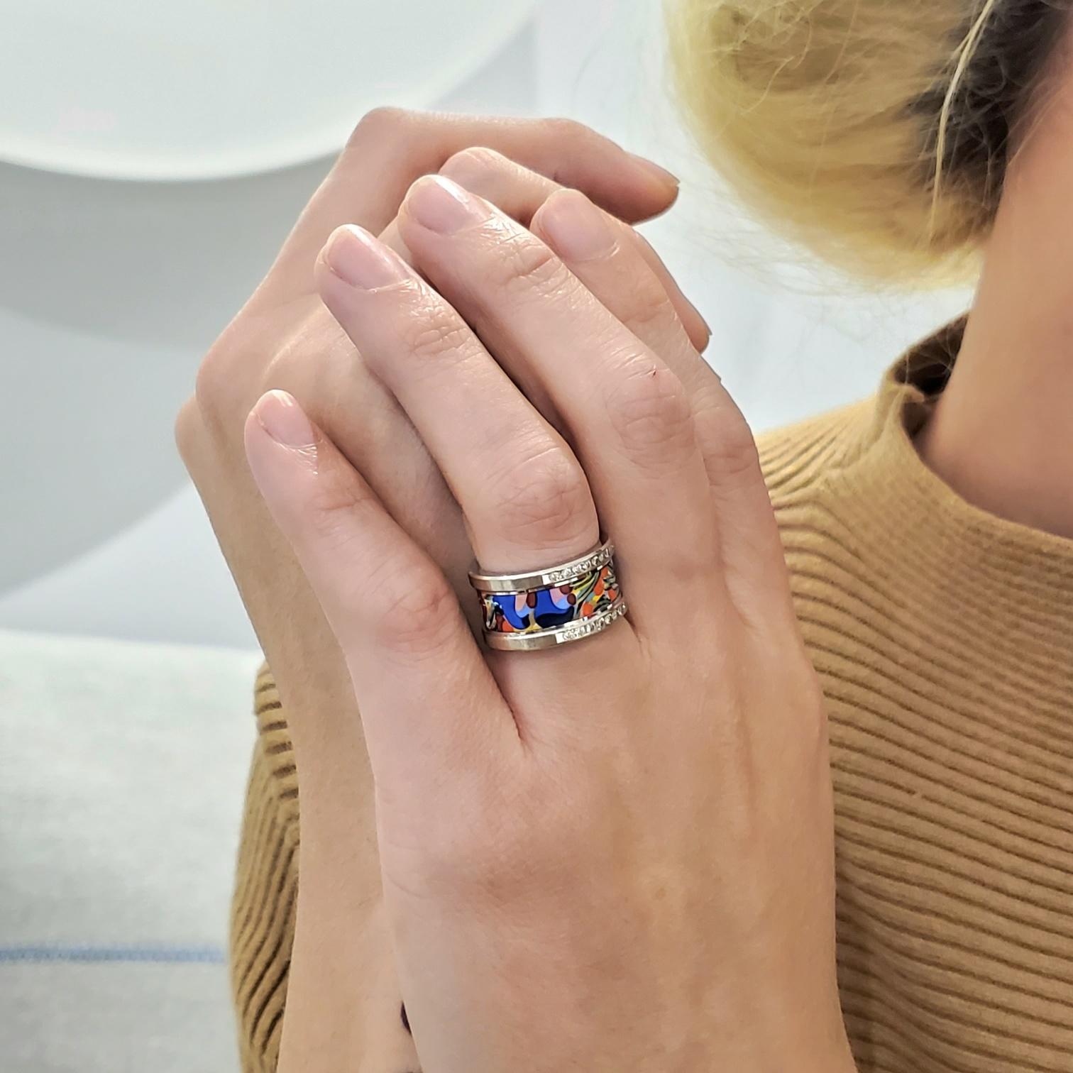 A ring band designed by Frey Wille in Austria.

Beautiful and colorful contemporary piece, created in Vienna Austria by the luxury jewelry house of Frey Wille. This ring band has been crafted in solid white gold of 18 karats with high polished