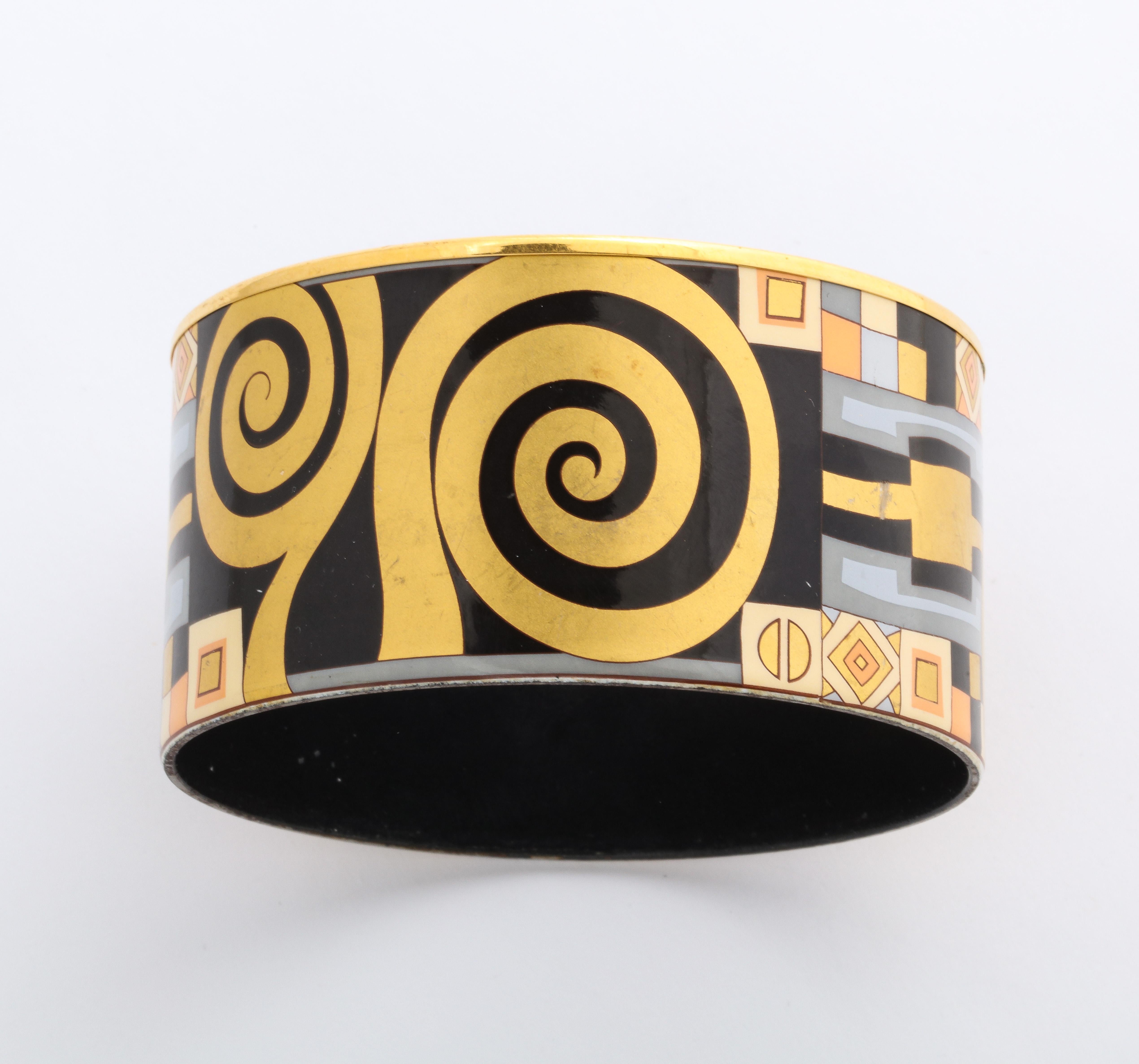 This beautiful Frey The jewelry is made in ViennaWille enamel bangle is from an earlier collection and has an unusual design on black enamel .   FreyWille jewelry is quality Austrian enamel with 18K overlay on metal. The jewelry is made in Vienna