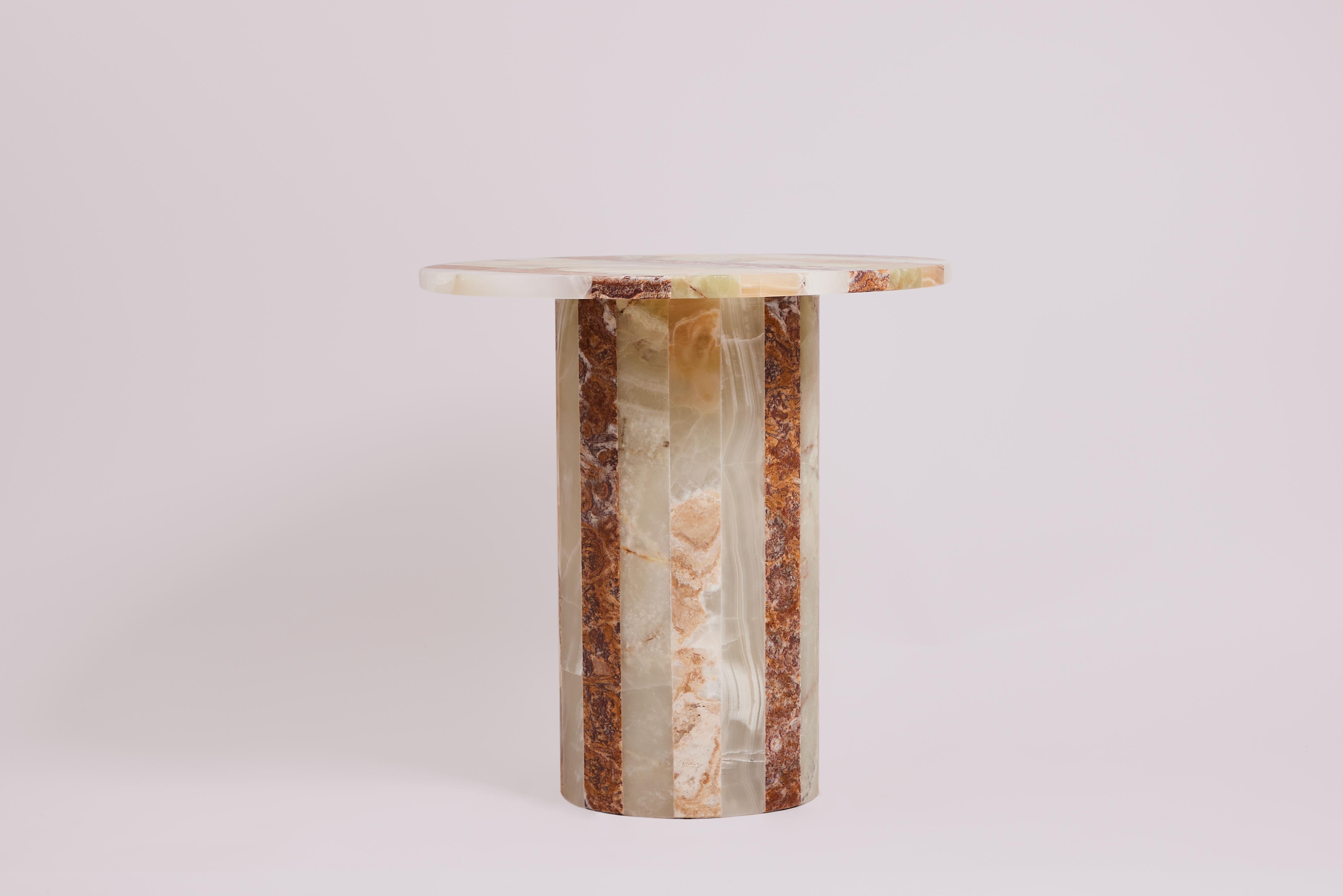 Frida Side Table by Studio Gaia Paris
Dimensions: ⌀ 50 x H 50 cm
Materials: White, Red, Green and Amber Onyx.


The Frida Striped Onyx Side Table is a refined and elegant piece of furniture that will bring a touch of luxury to any interior. Made