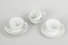 Friedl Holzer-Kjellberg for Arabia. Four porcelain demi-tasse cups with saucers.