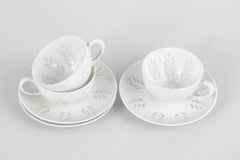 Friedl Holzer-Kjellberg for Arabia. Three porcelain demi-tasse cups with saucers