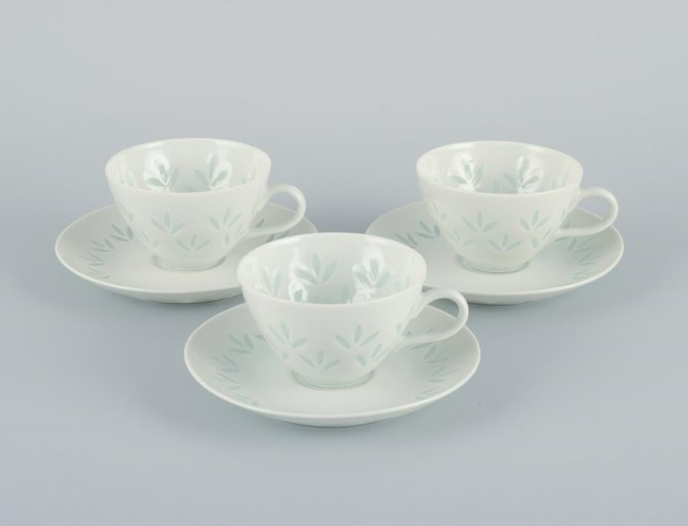 Friedl Holzer-Kjellberg (1905-1993) for Arabia. 
Three sets of Arabia mocha cups and saucers in rice grain porcelain.
Mid-20th century.
Signed.
In excellent condition.
Cup: 7.0 cm. without handle x 4.5 cm.
Saucer: 11.3 cm.