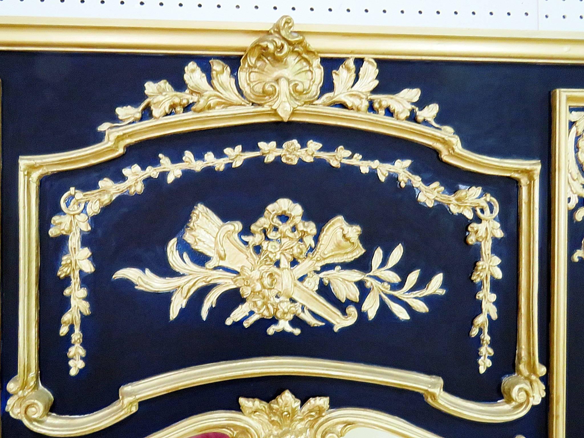 Friedman Brothers Neapolitan style wall mirror. Carved with blue paint and gilt trim. The mirror, itself, measures 33.75