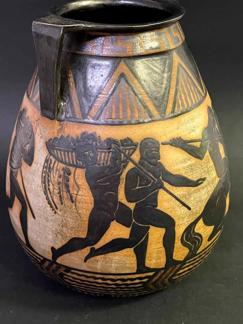 Rare and beautifully made, this vase decorated with a stylized frieze of nude male figures hunting and preparing for battle was clearly inspired by ancient Greek art and pottery, as well as the modern 1920s style we now call Art Deco.  The figures